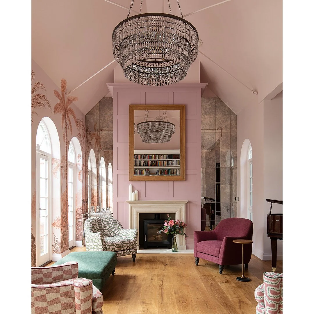 Morning room, high ceilings, muted pink walls, chandelier
