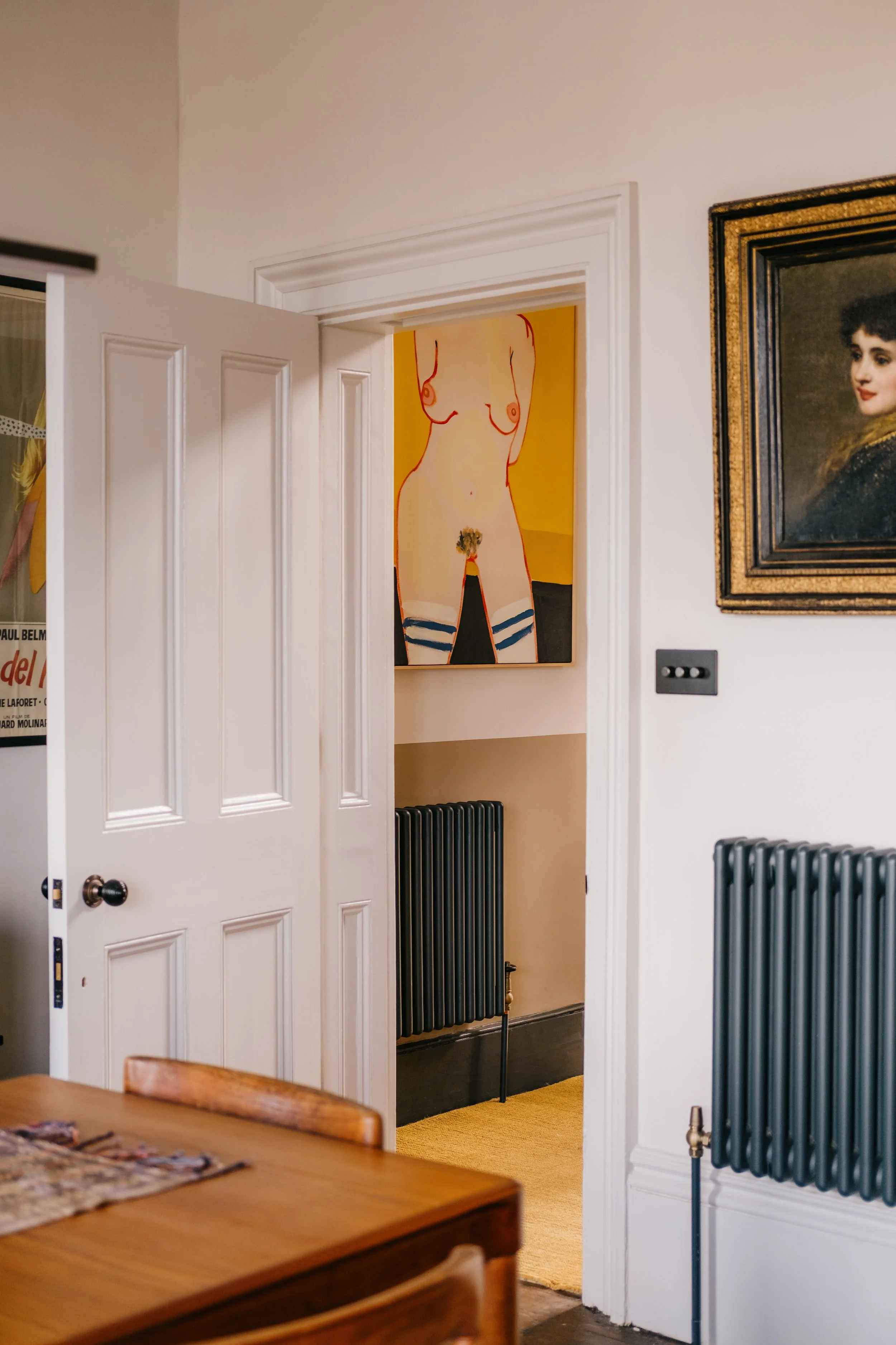 View through door to painting of woman copy.jpg