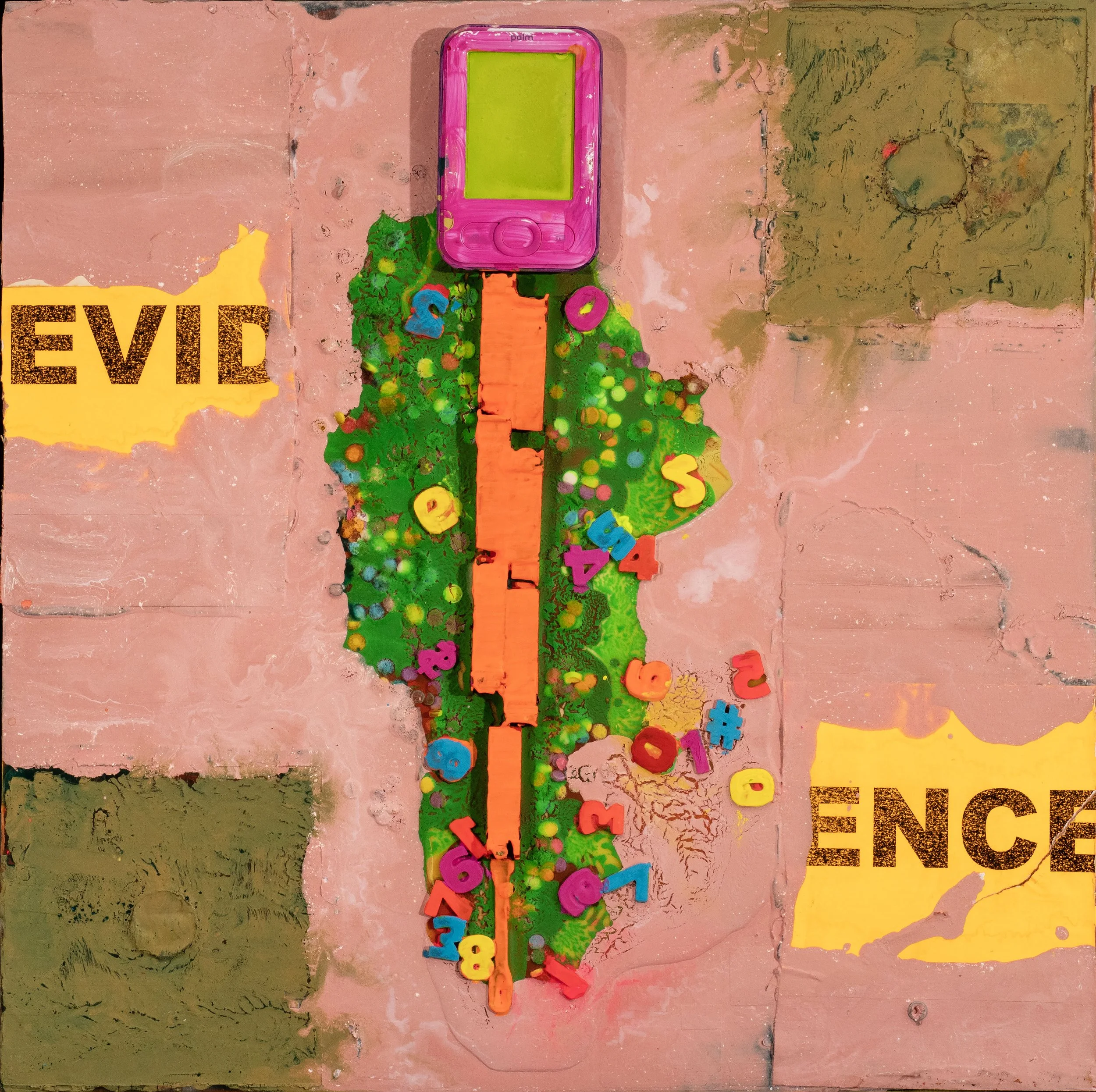 A pink children's electronic device with a yellow screen, placed on a pink and yellow brick wall background. The device is surrounded by colorful foam letters and numbers, with a scattered and artistic appearance.