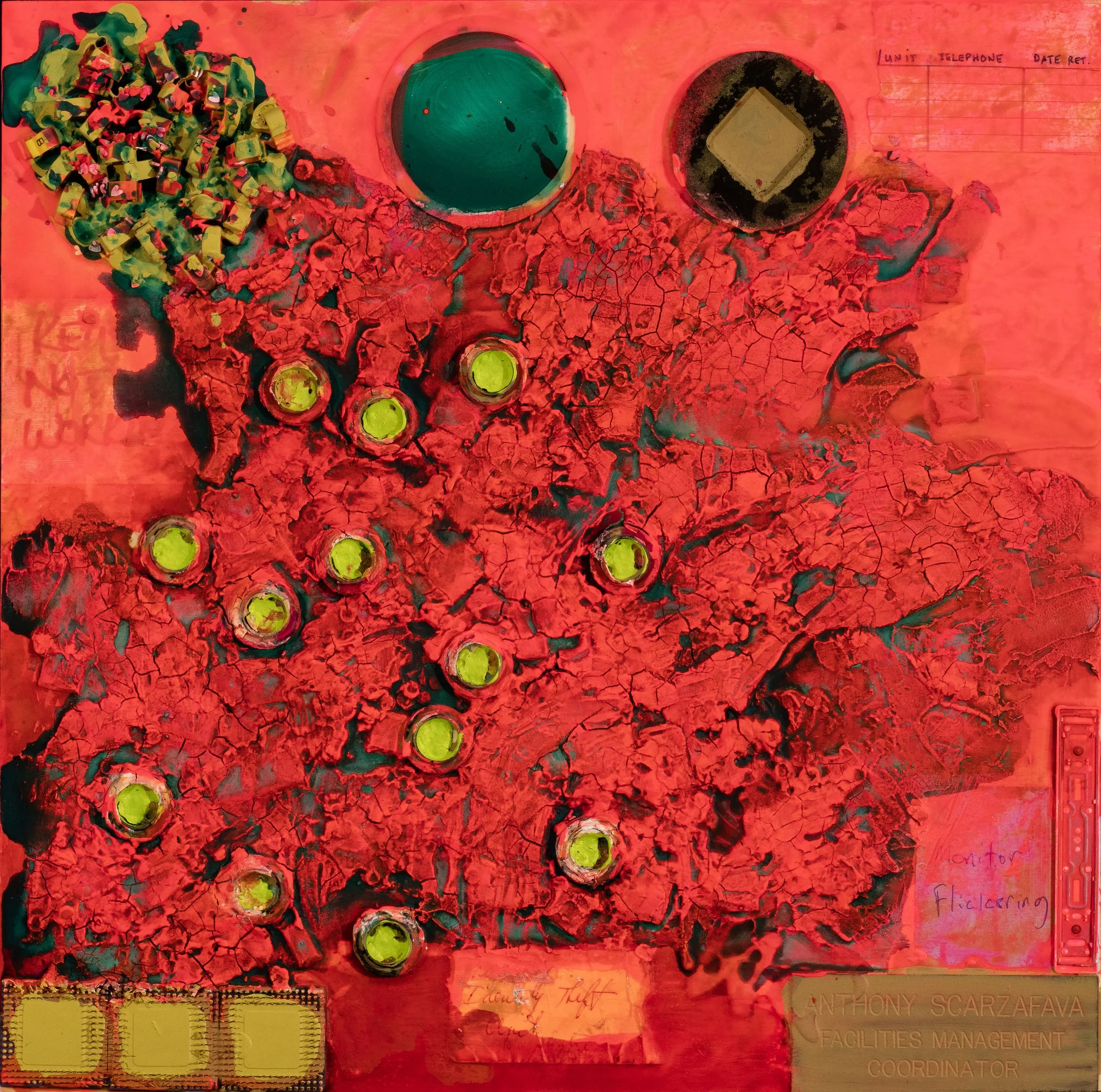 An overhead view of a colorful experimental art piece featuring various objects arranged on a red textured surface. The scene includes a pile of multicolored, crumpled materials on the left, and circular containers with green and black contents at th