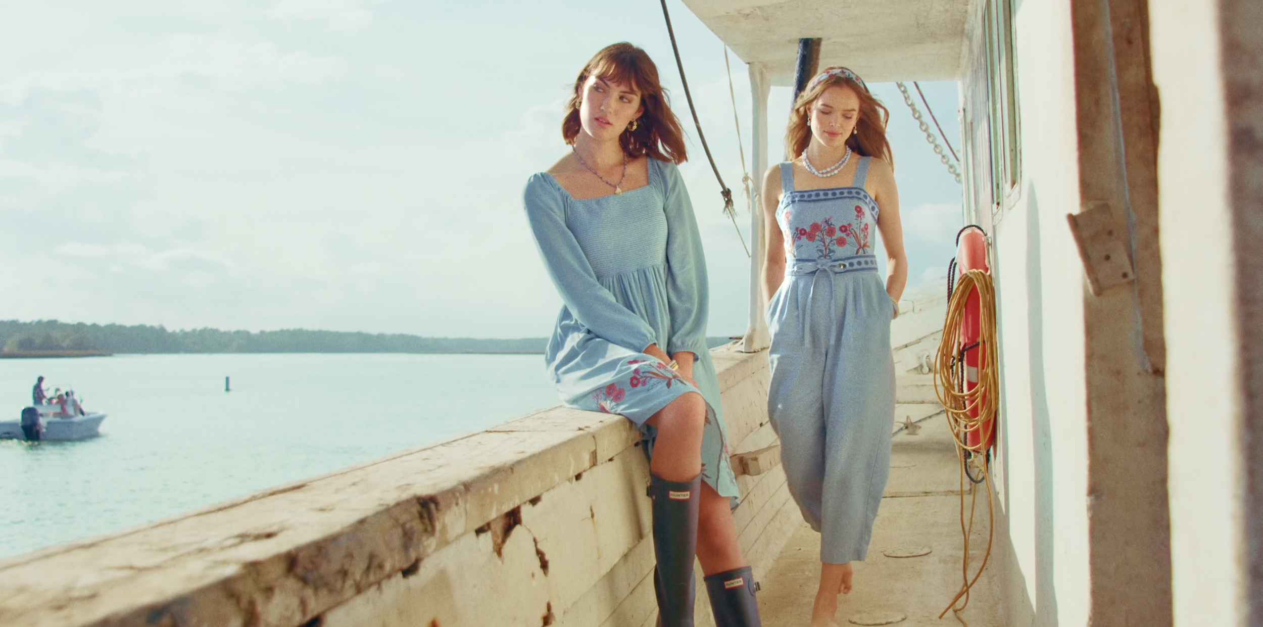 Beau Kester Director and Director of Photography capturing Bella Davison Zo Novak gazing thoughtfully outside on an old oyster boat in South Carolina for a luxury fashion film
