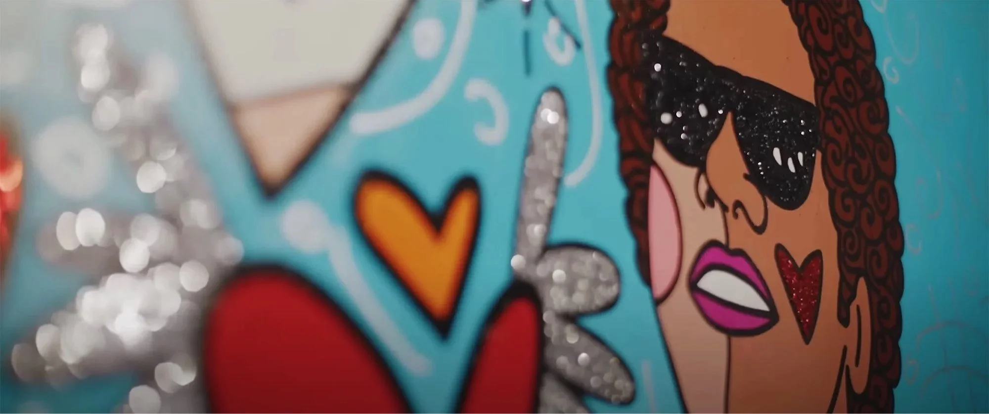 Beau Kester Director and Director of Photography capturing still from The Britto Doc documentary about Romero Britto’s artistic journey from Brazil to global influence in vibrant pop art storytelling.