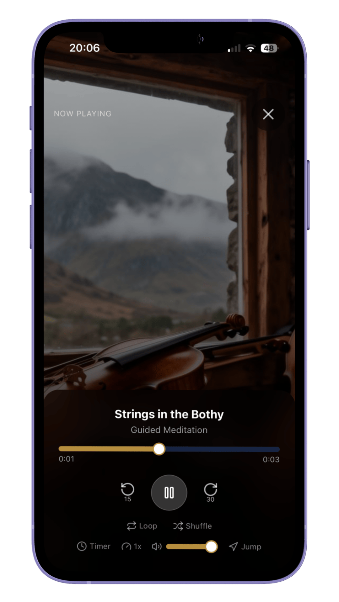 A mobile phone screen showing a meditation app with a background of a mountain landscape and a violin resting on a wooden surface. The app is playing a guided meditation called "Strings in the Bothy."