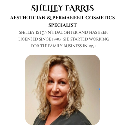 Shelley Farris with curly blonde hair, wearing a dark top, smiling softly at the camera against a plain background.