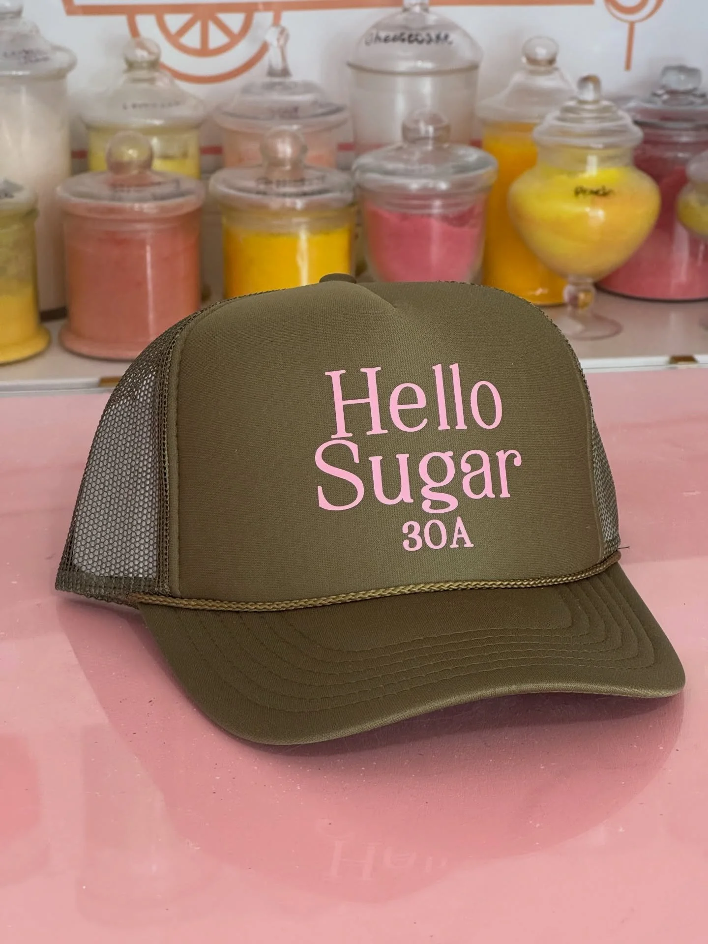 JUST IN!!! 🚨 New Hello Sugar hats are here and we are already at limited stock after hitting the shelves today at noon!! Stop by or DM to purchase while supplies last! 🤍🩷🤍🩷