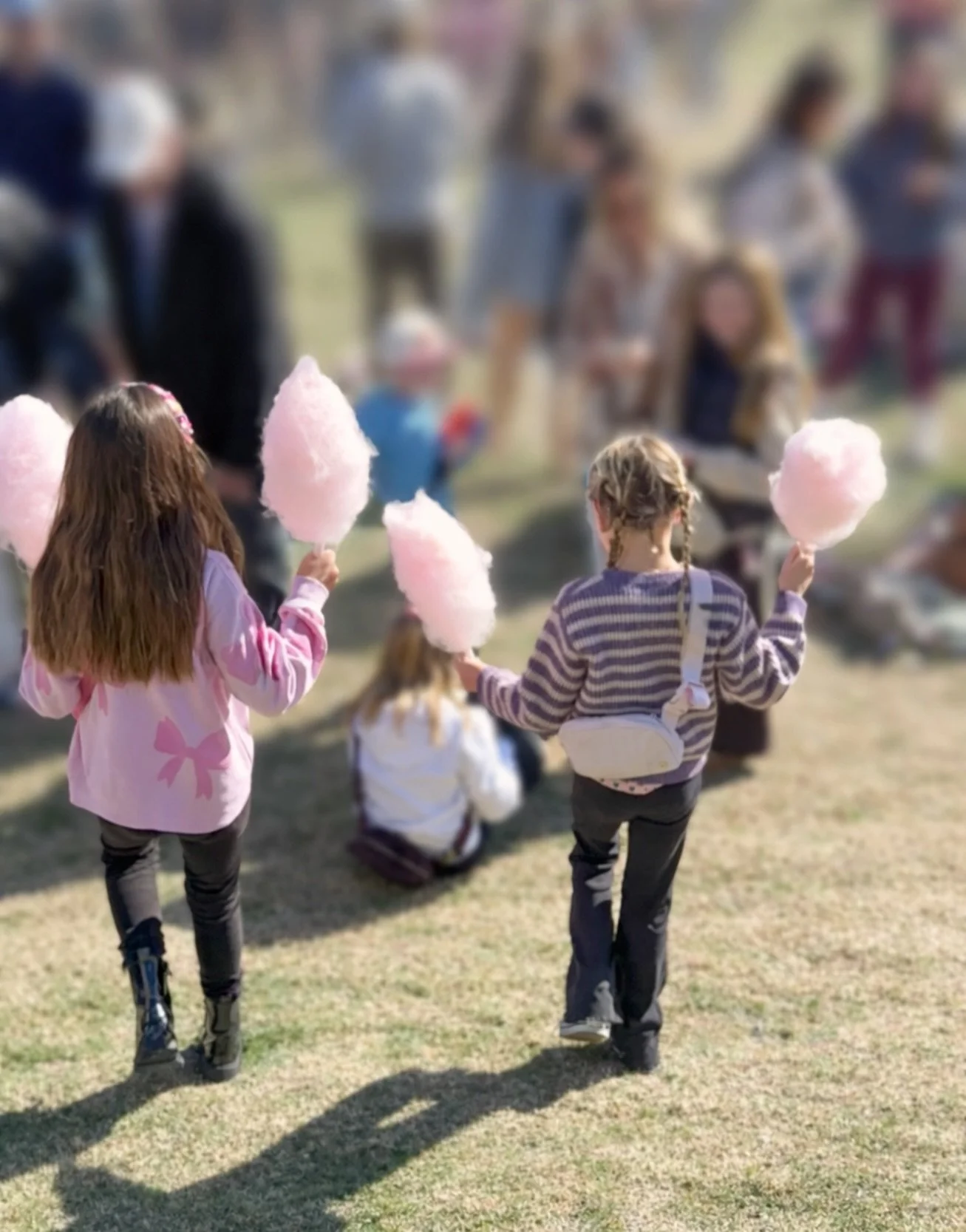 girls with cotton candy at market