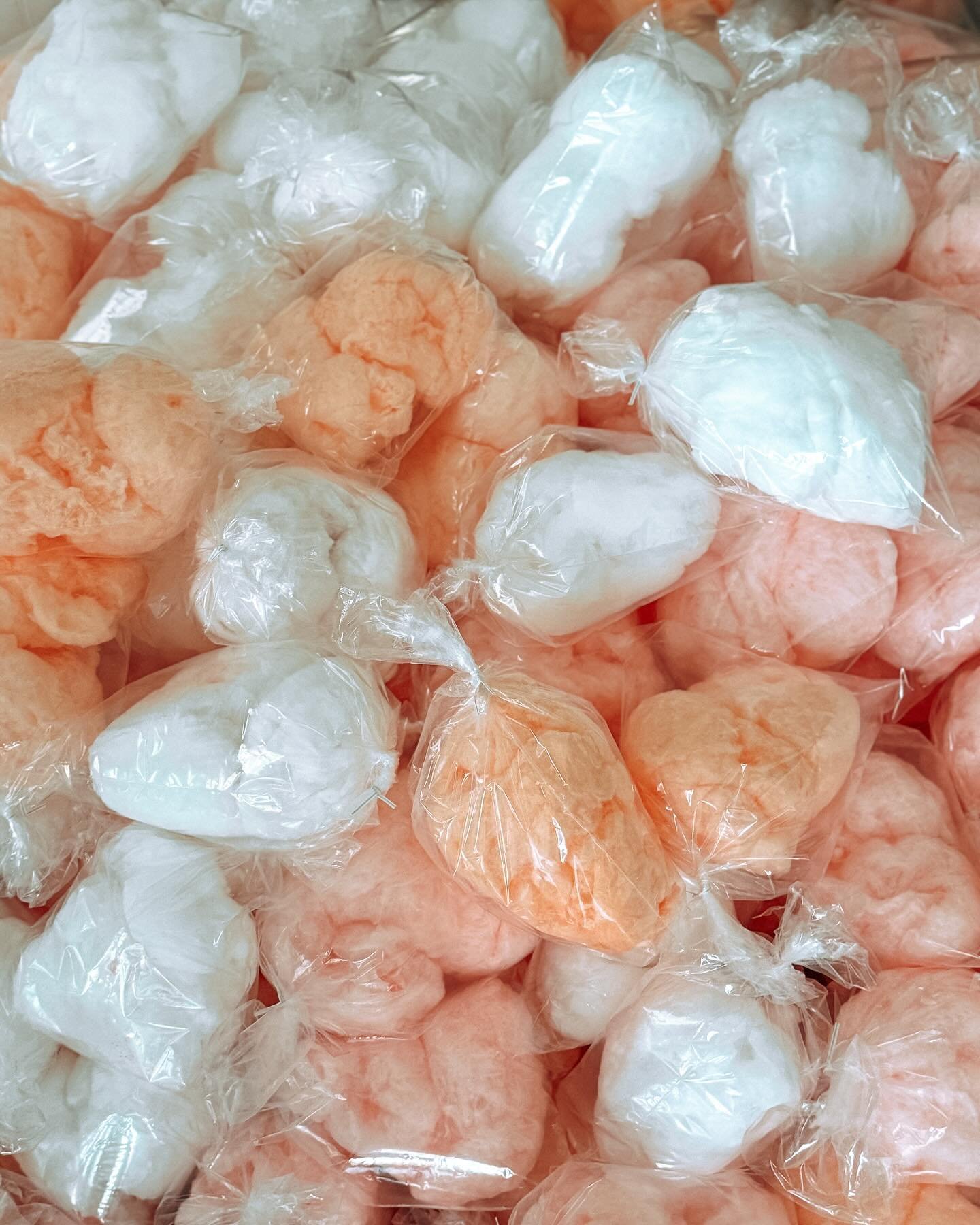 pink and white fresh bags of cotton candy
