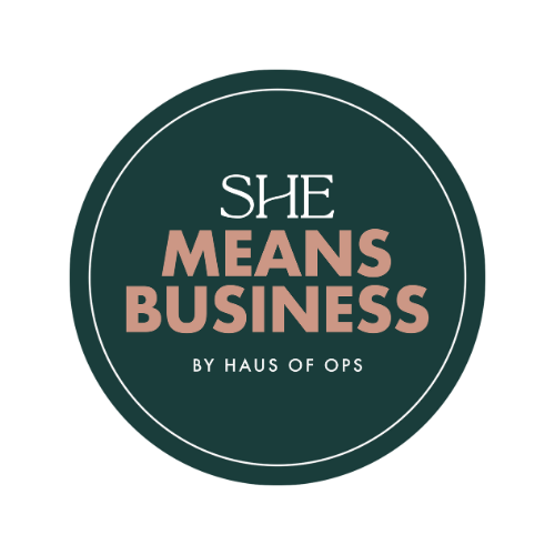 A circular logo with the text "She Means Business by Haus of Ops" in pink and black on a dark green background.