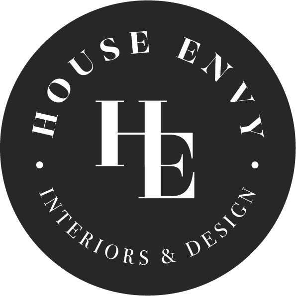 Logo for 'House Envy Interiors & Design' with initials H, E in the center, surrounded by the text 'House Envy Interiors & Design' in a circular pattern.