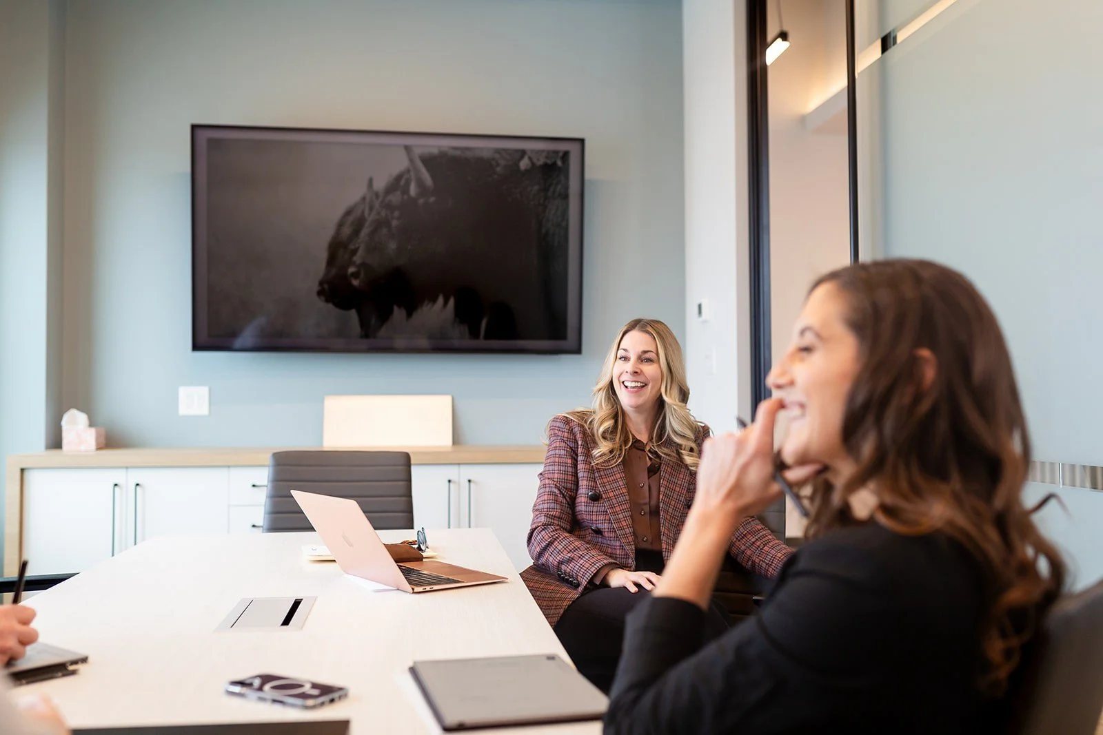 Business coaching session with leadership team collaborating in a modern boardroom during a strategic planning discussion