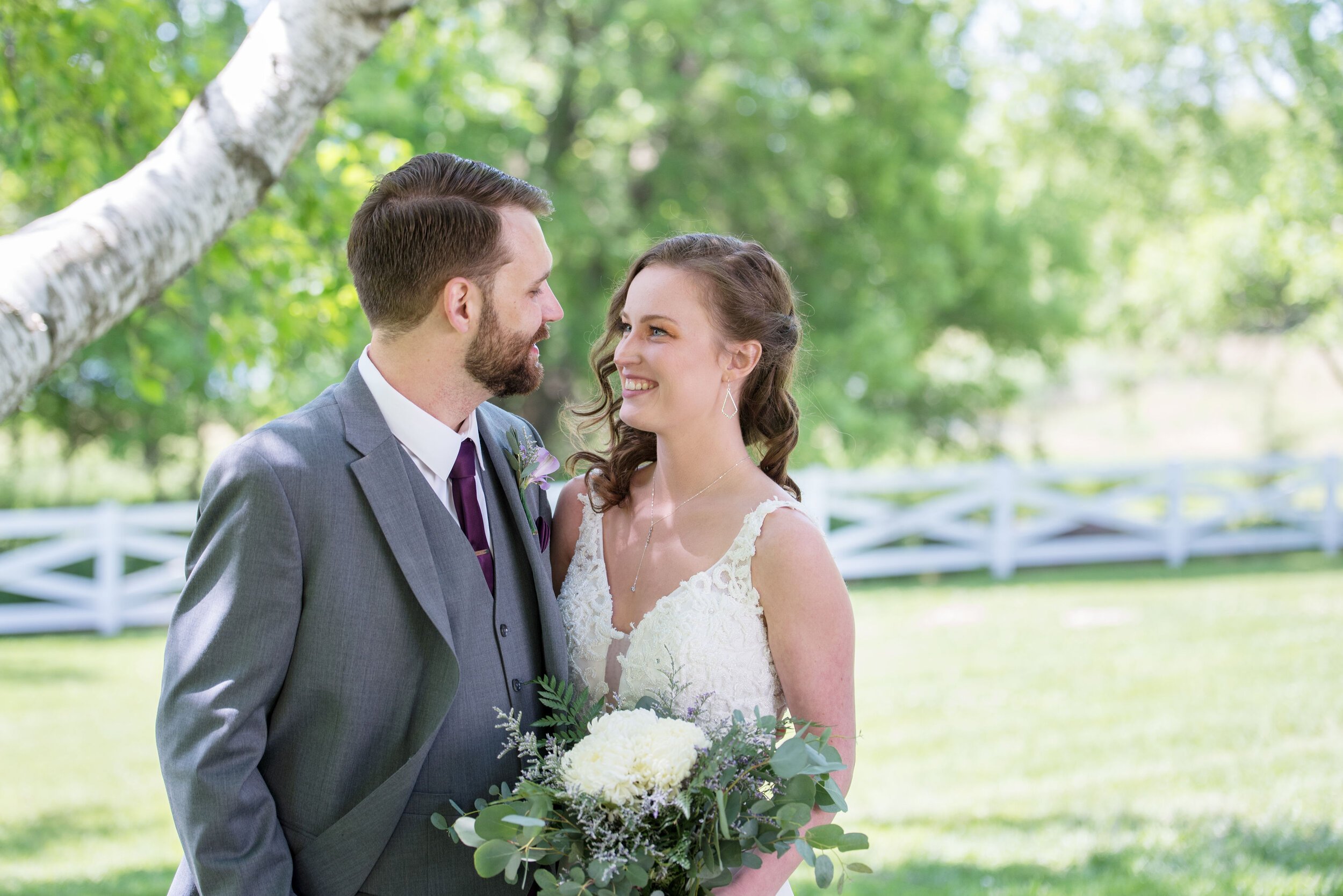 EricksonFarmsteadWeddingBrideandGroomSmiling.jpeg