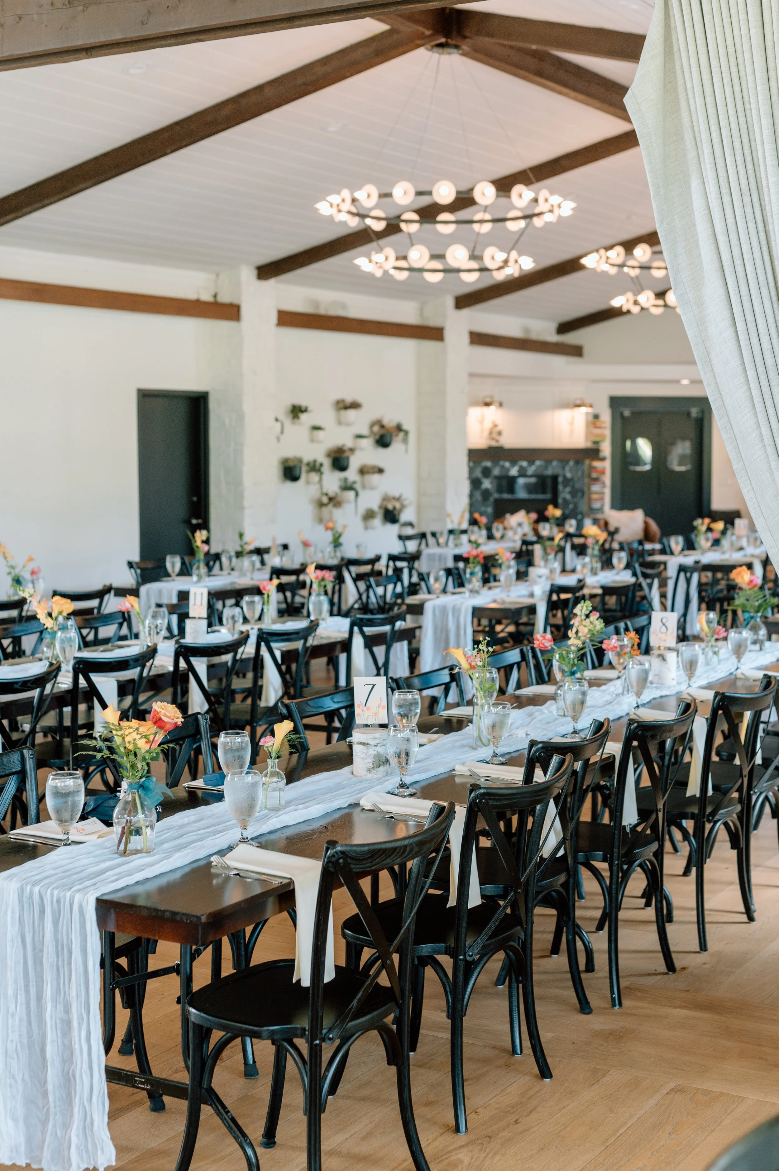 Long tables set up in the reception space at Belle Ame wedding venue, Wisconsin wedding photographer