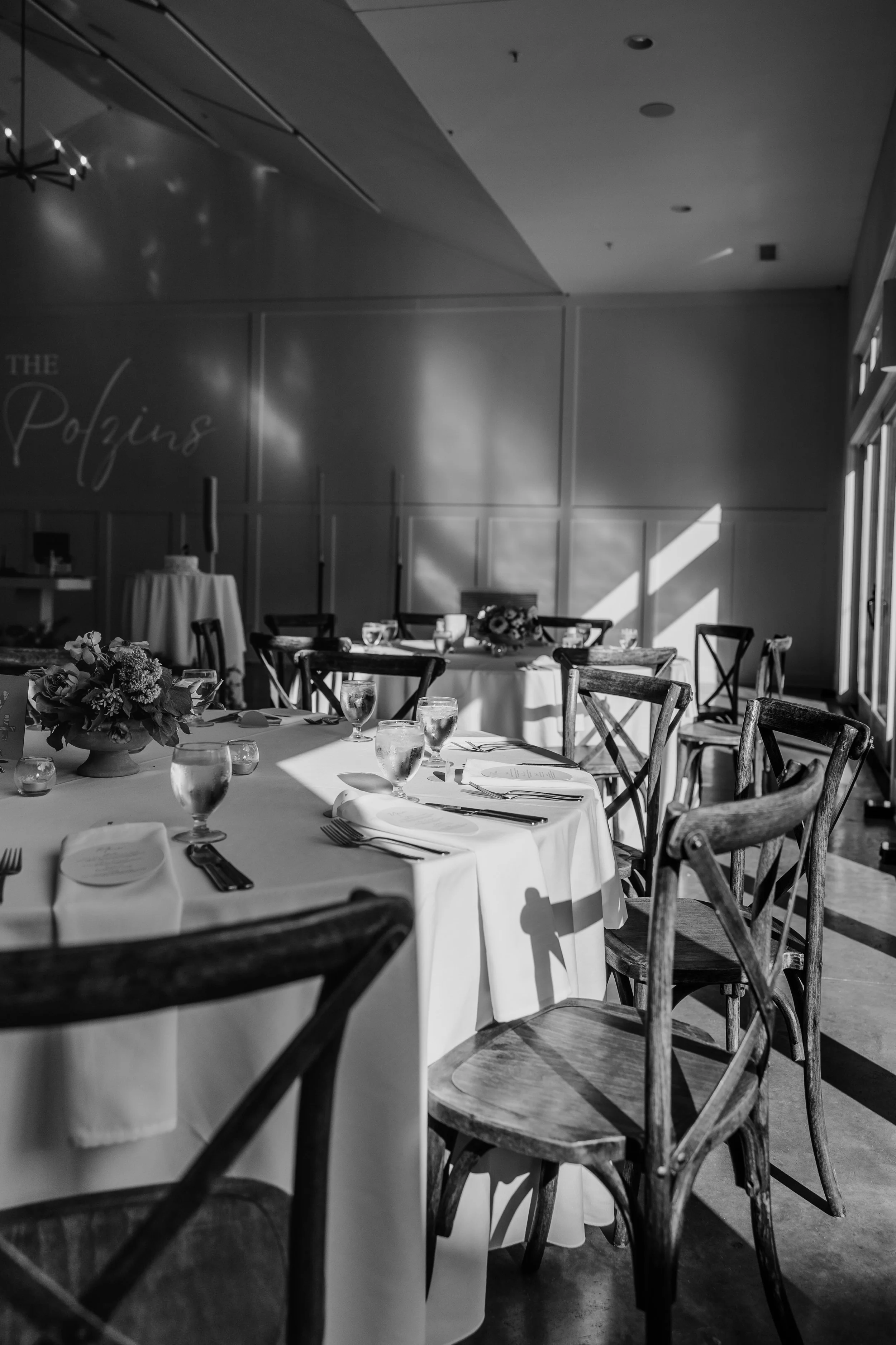 Black and white image of light streaming into the reception space at the Hutton House in Medicine Lake, MN