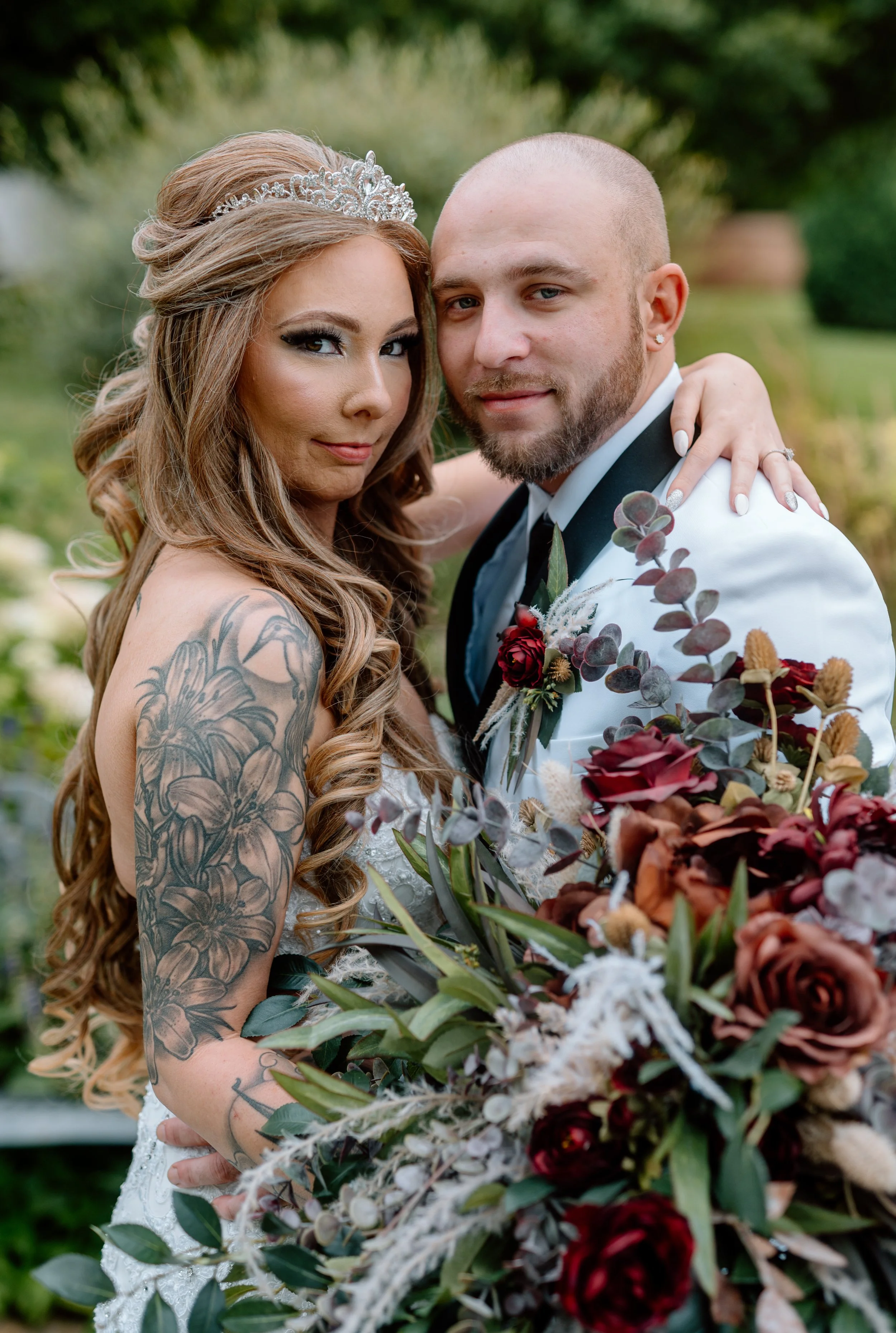 Legacy Hill Farm Wedding Day couple in white tux, white dress, tiara, and marroon bouquet