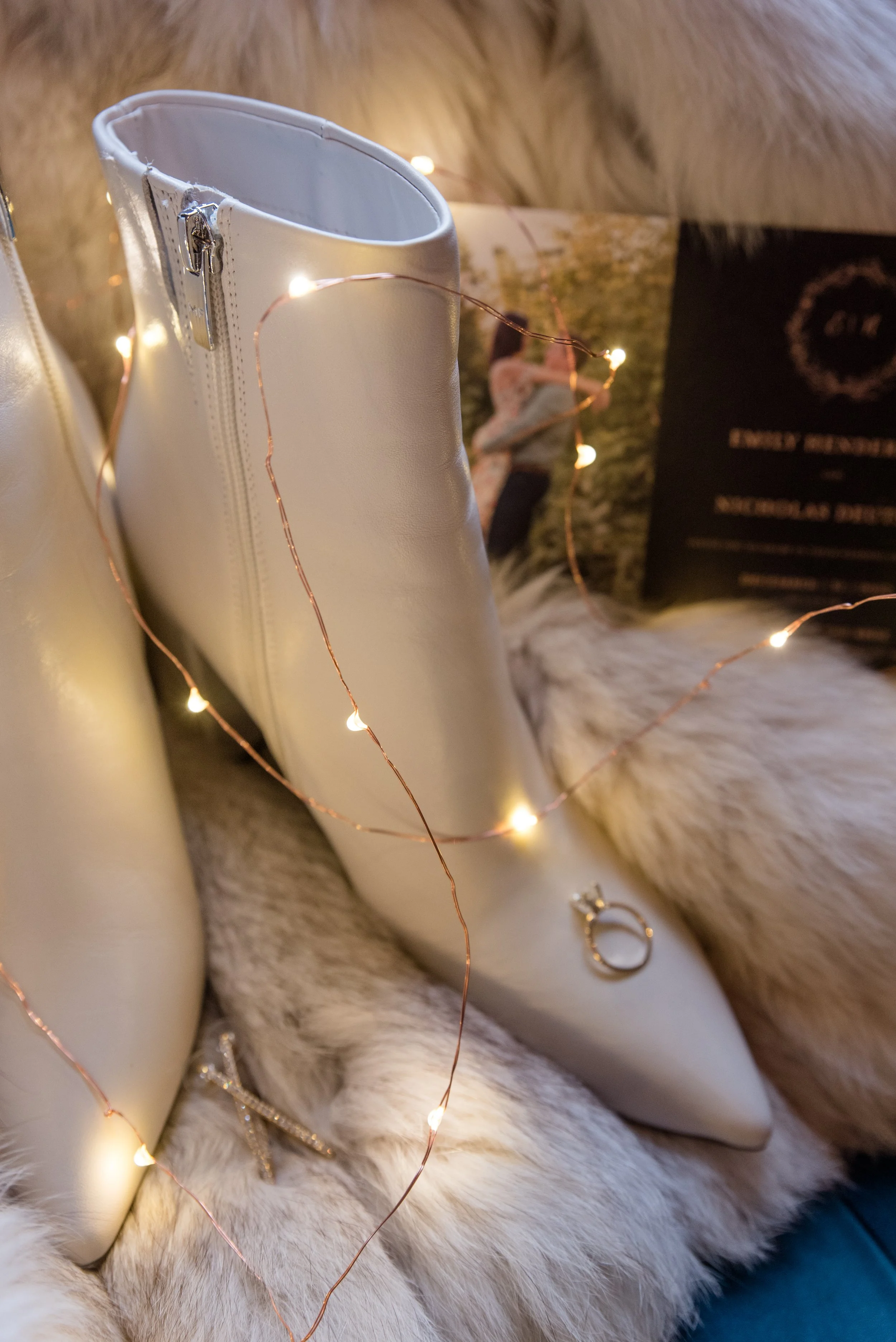 Winter wedding day details with faux fur coat and white ankle boots
