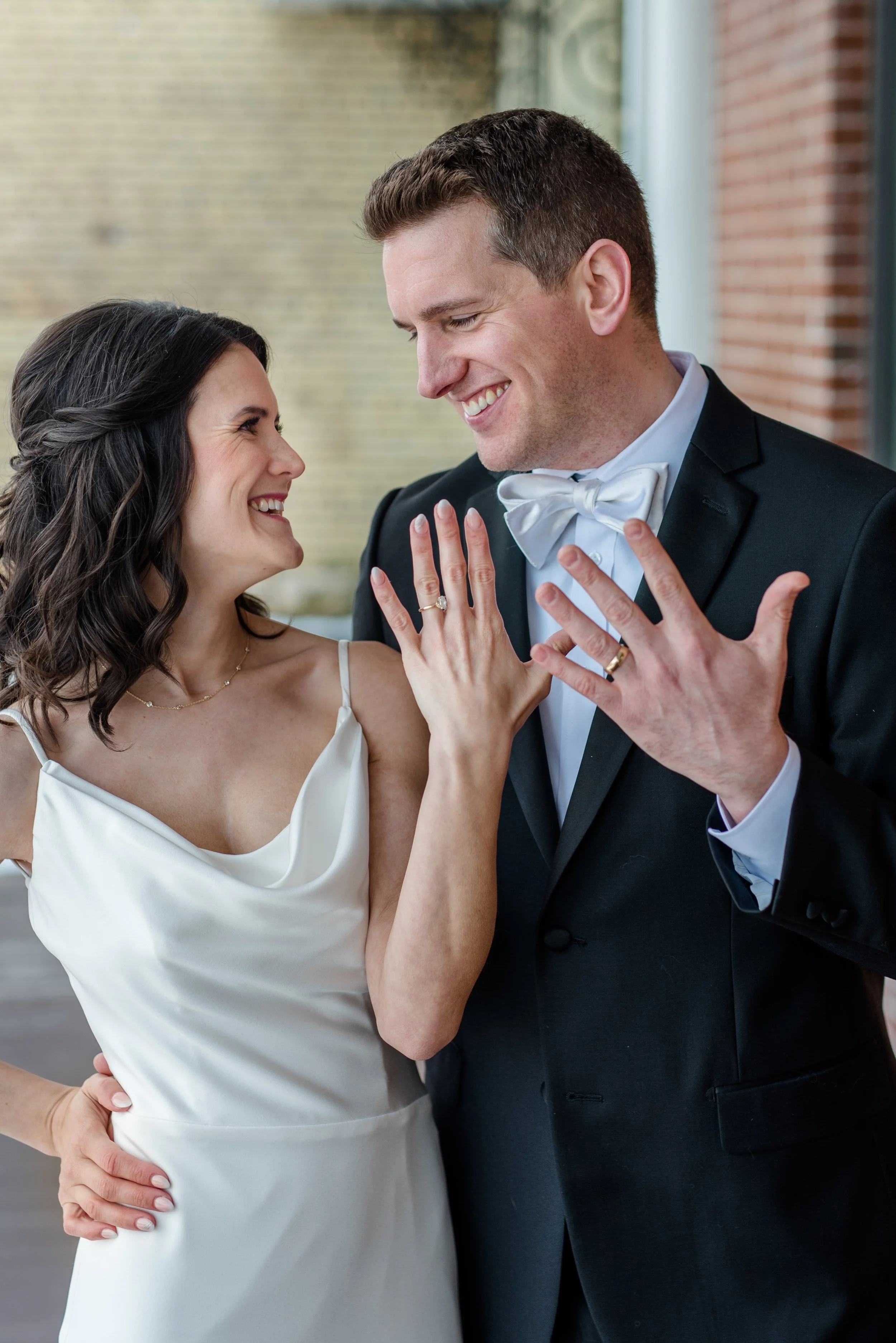Couple celebrates their marriage by showing off their new wedding rings on their New Year's Eve wedding day at The Broz in New Prague, MN