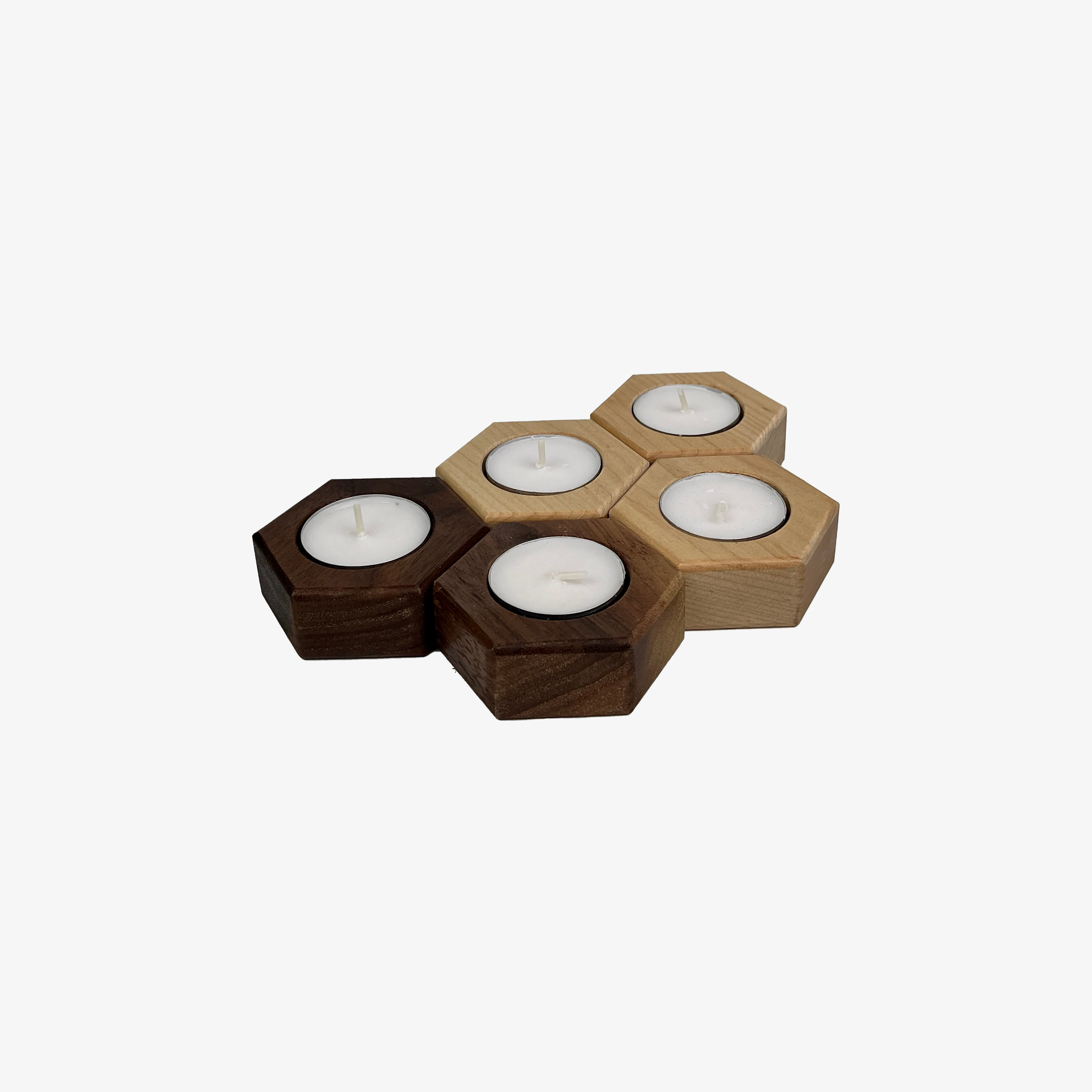 Five hexagonal candle holders are shown. Two are walnut, three are maple.