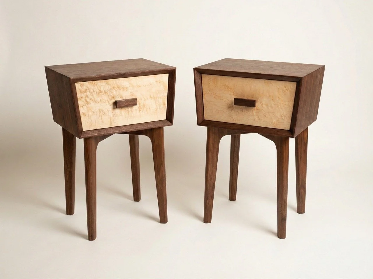 Trapezoid nightstand made of walnut with maple drawer fronts