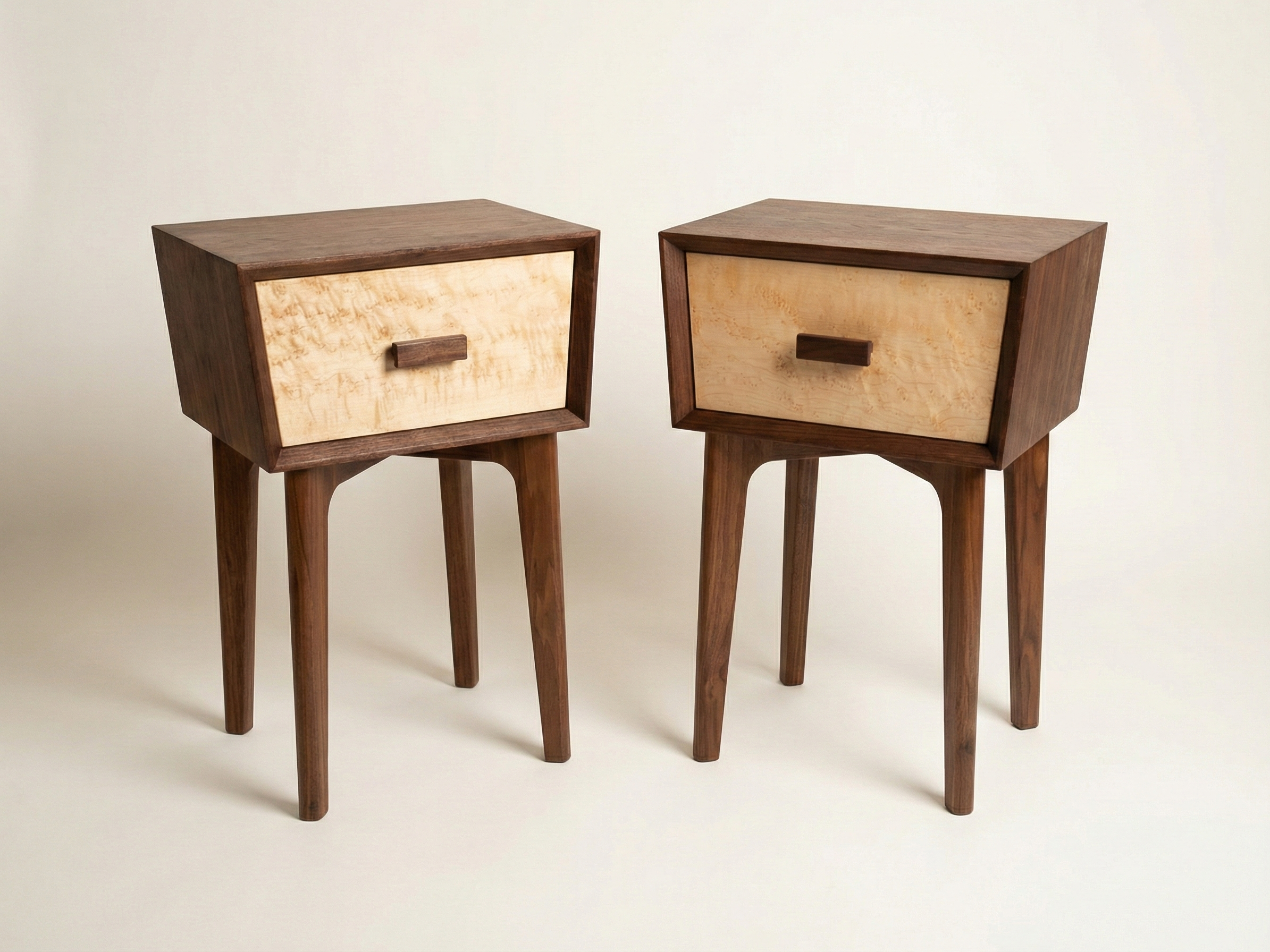Trapezoid nightstand made of walnut with maple drawer fronts