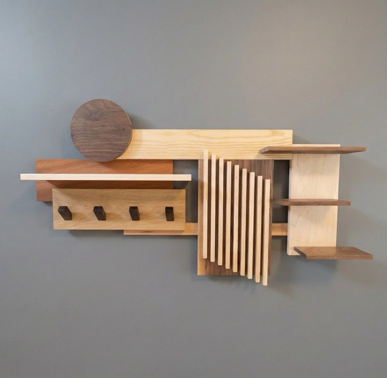 Wall shelf made of various sizes, shapes, and species of wood