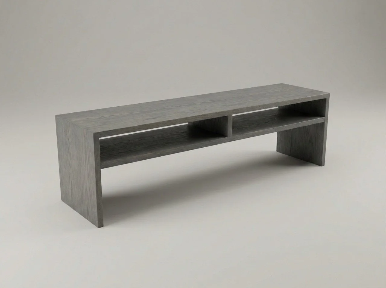 Long, low couch table made of ash and stained gray