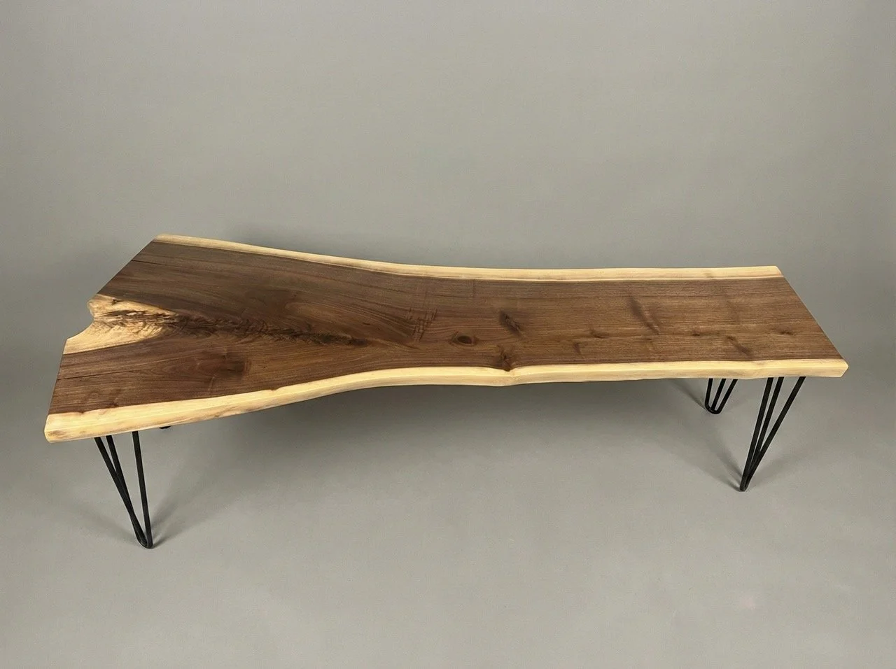 Live-edge walnut bench with black steel legs