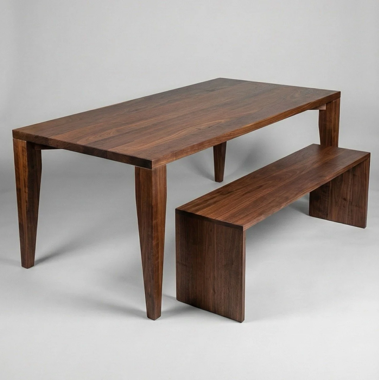 Walnut dining table with matching bench