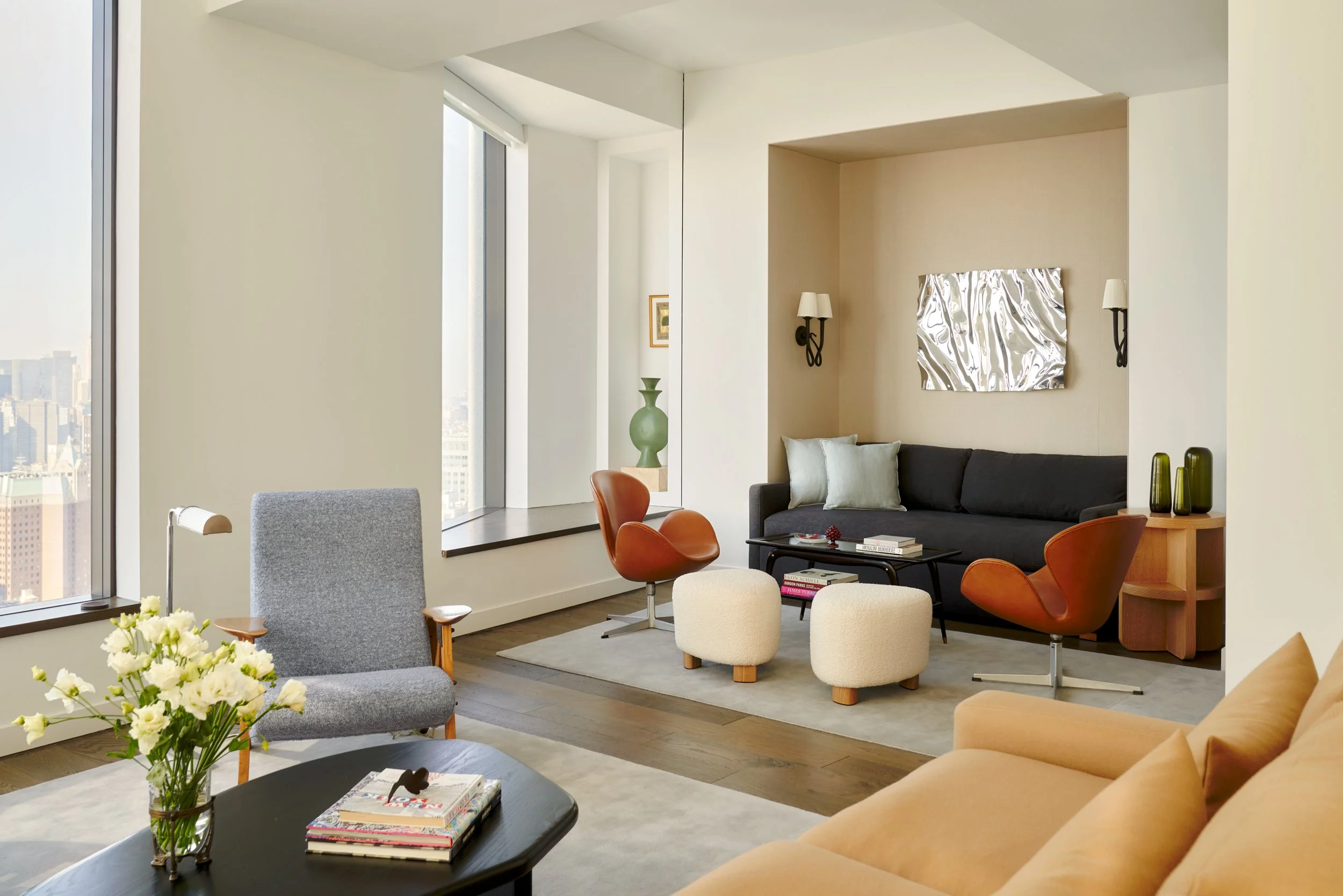 The upholstered niche crates a cozy sitting area. Interior Design by Gennett Studio.
