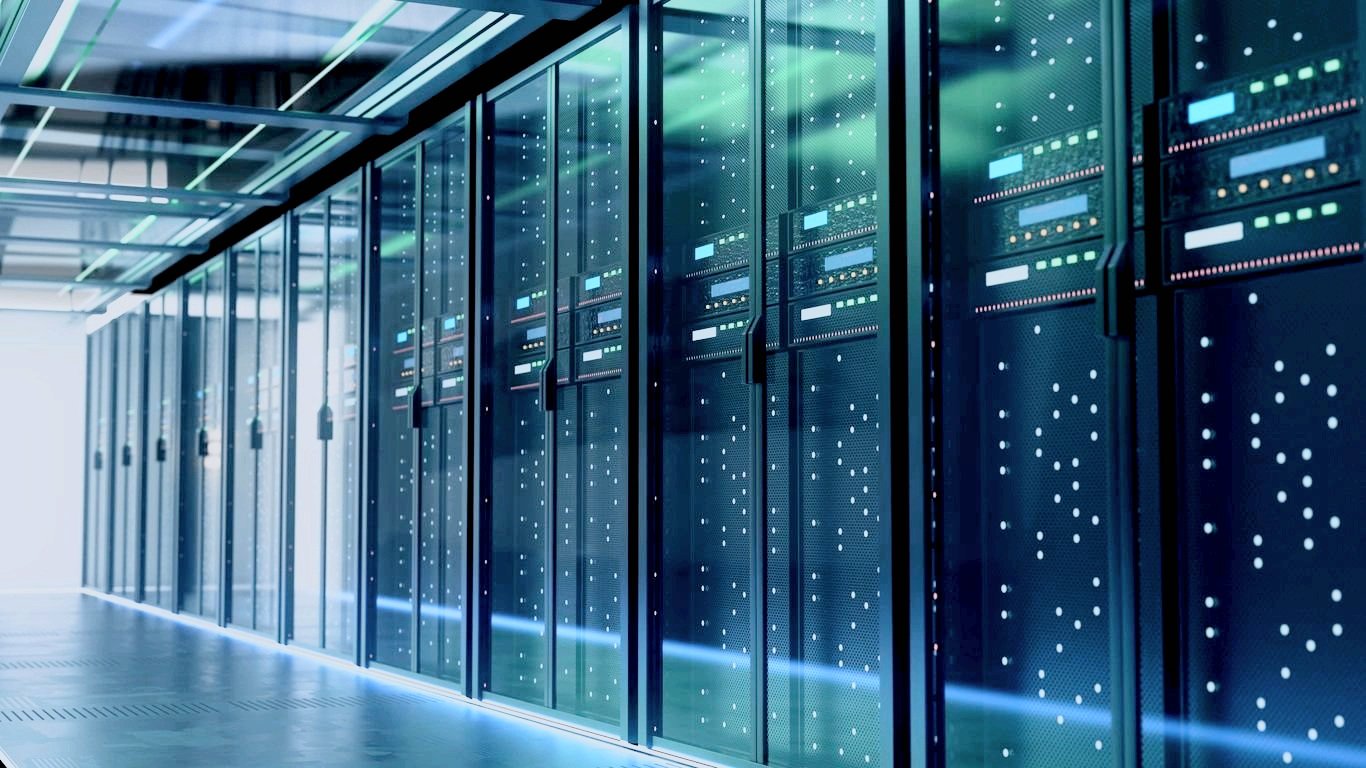 a room with a wall full of networking server racks