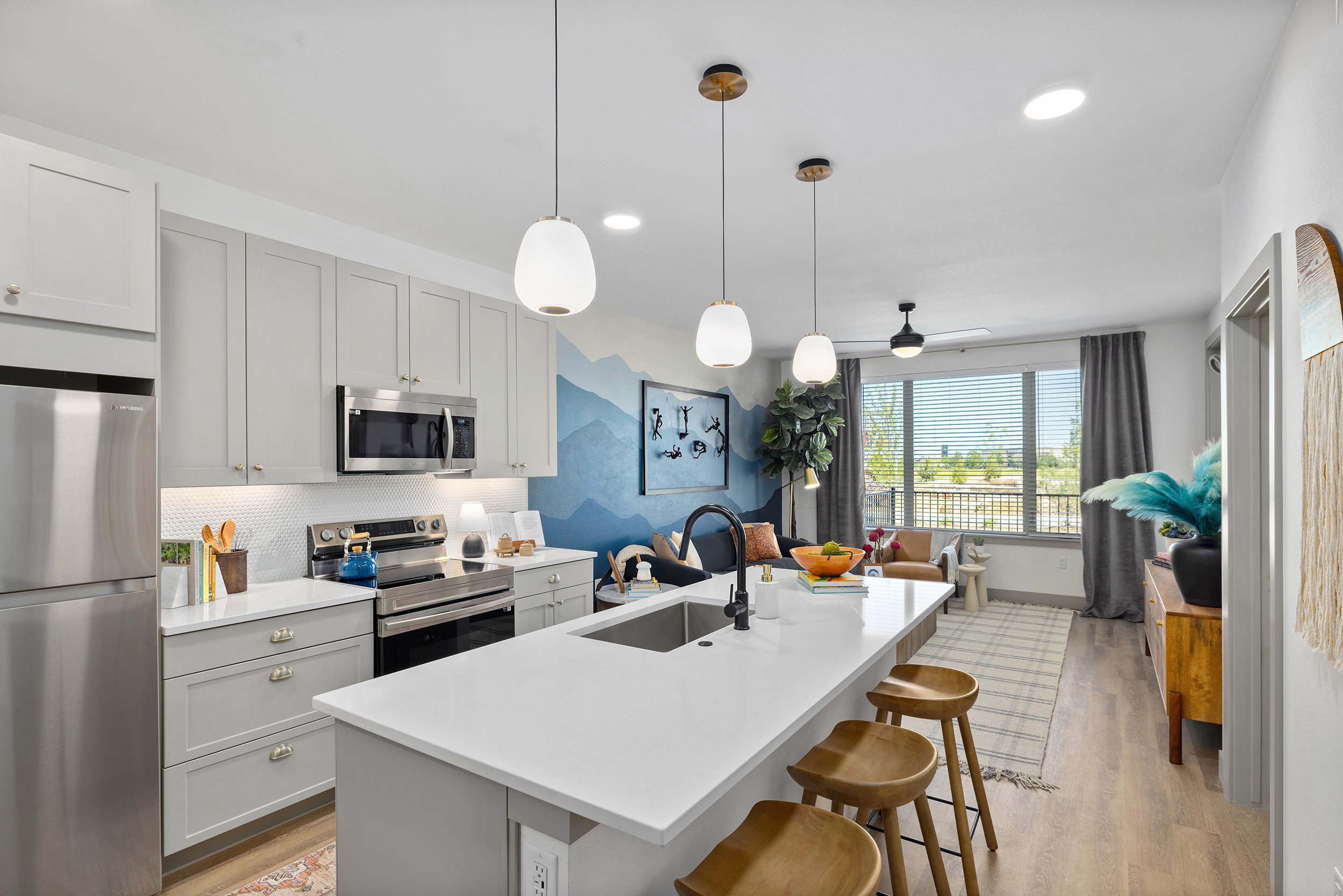 Brand New Apartment Kitchen with Dove Cabinetry and black & and brass accents in Denver, CO