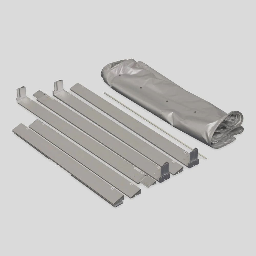 Several metal bed slats with a rolled-up plastic sheet and a metal support rod.
