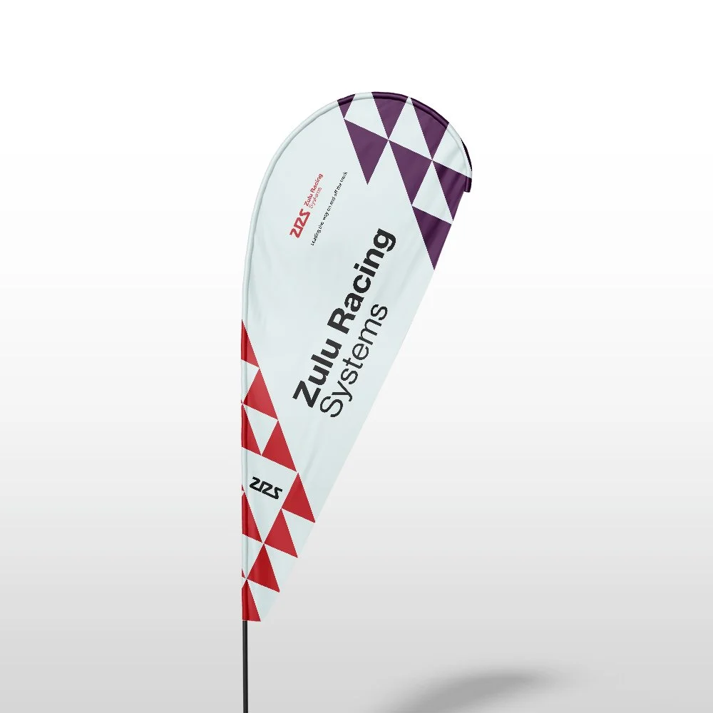 A promotional feather banner for Zulu Racing Systems with red and purple geometric patterns.