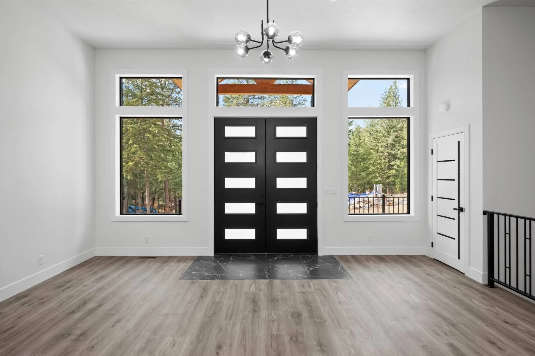 Lovely interior entry way or living room with lots of light and white paint - Home Builders Spokane WA - Diamond Homes