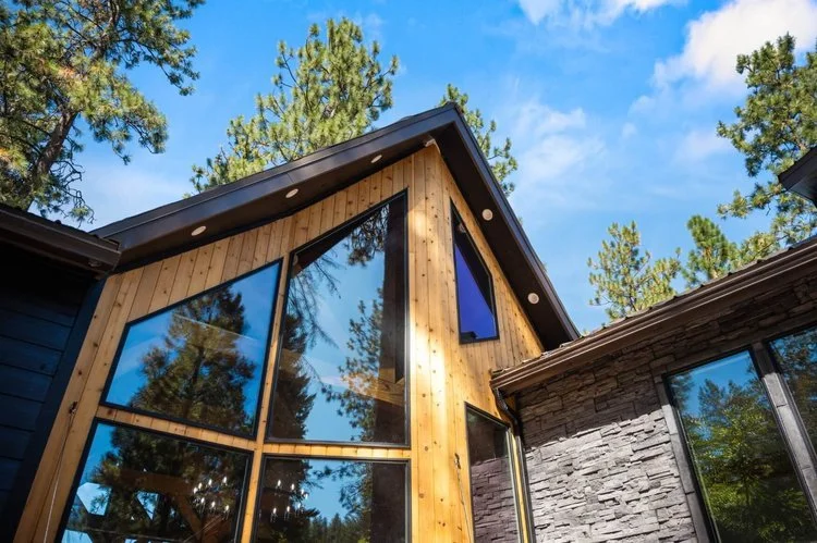 Beautiful large glass windows with wood exterior and trees and blue skies - Home Builders WA - Diamond Homes