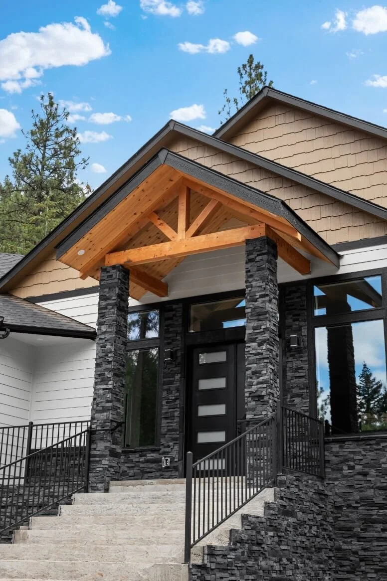 Dark stone patio pillars and front of house for expert color tones - Home Builders Spokane WA - Diamond Homes