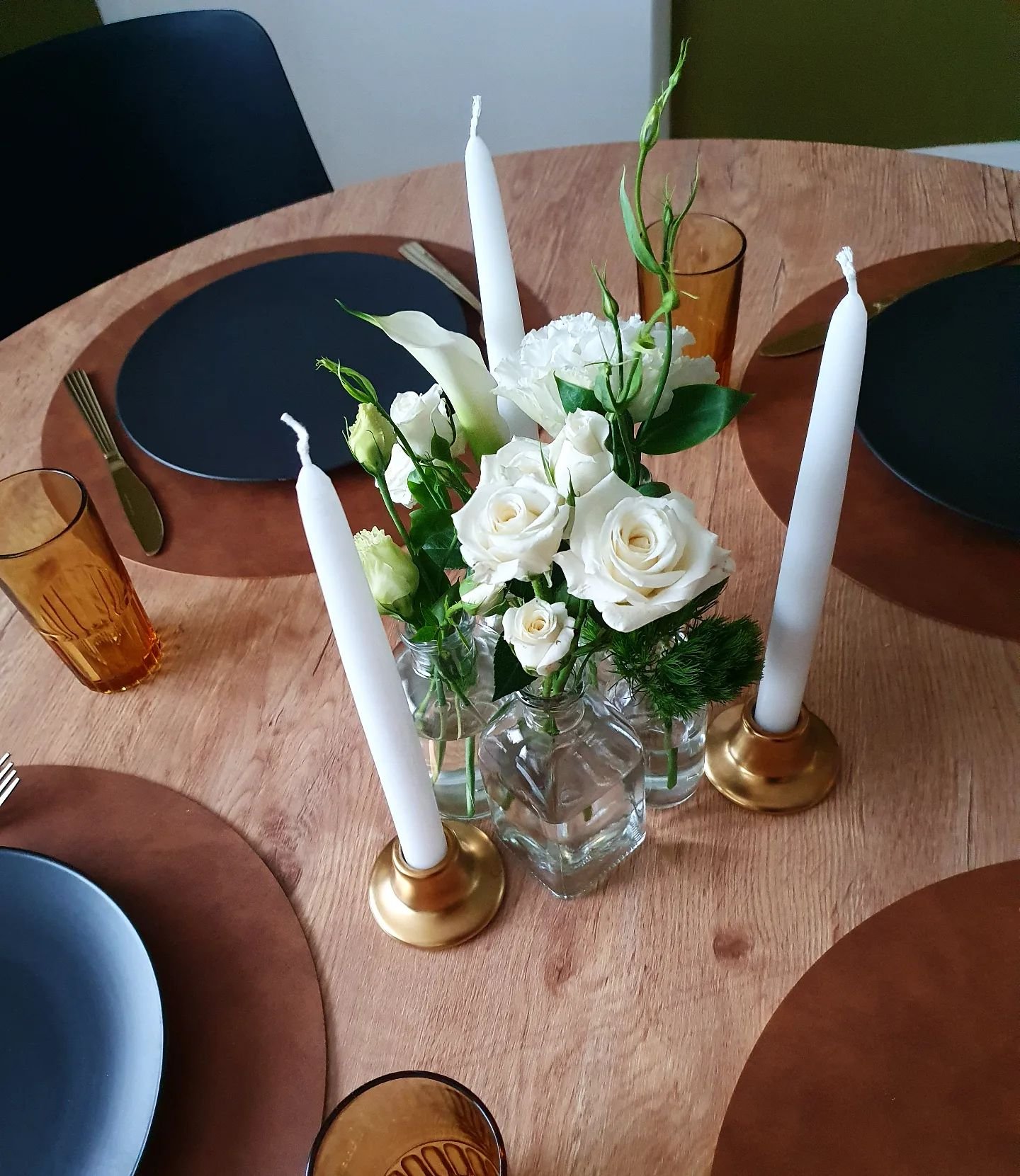 Bud vases + candles make a fantastic lower cost solution for a round table wedding centrepiece. 

They look great in clusters of 5 or more, depending on the table size. 

Perfect for minimalists, or couples who'd rather splash their floral budget on 