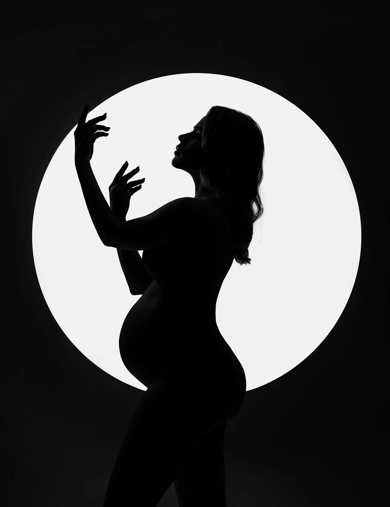 Prenatal photography session with moonlit pregnant silhouette portrait in Chicago - Filaneyka photo studio