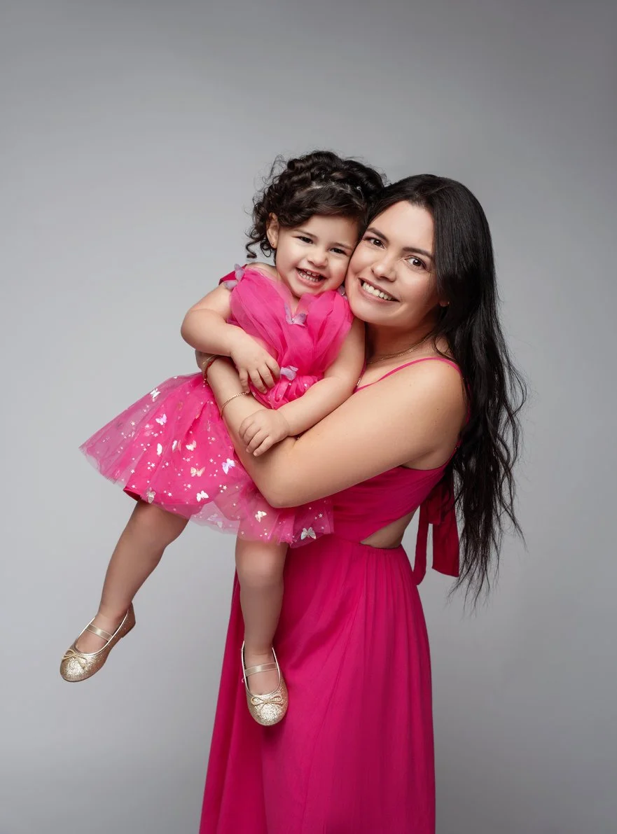 Family studio portrait with mom and daughter in matching pink dresses in Chicago - Filaneyka photo studio