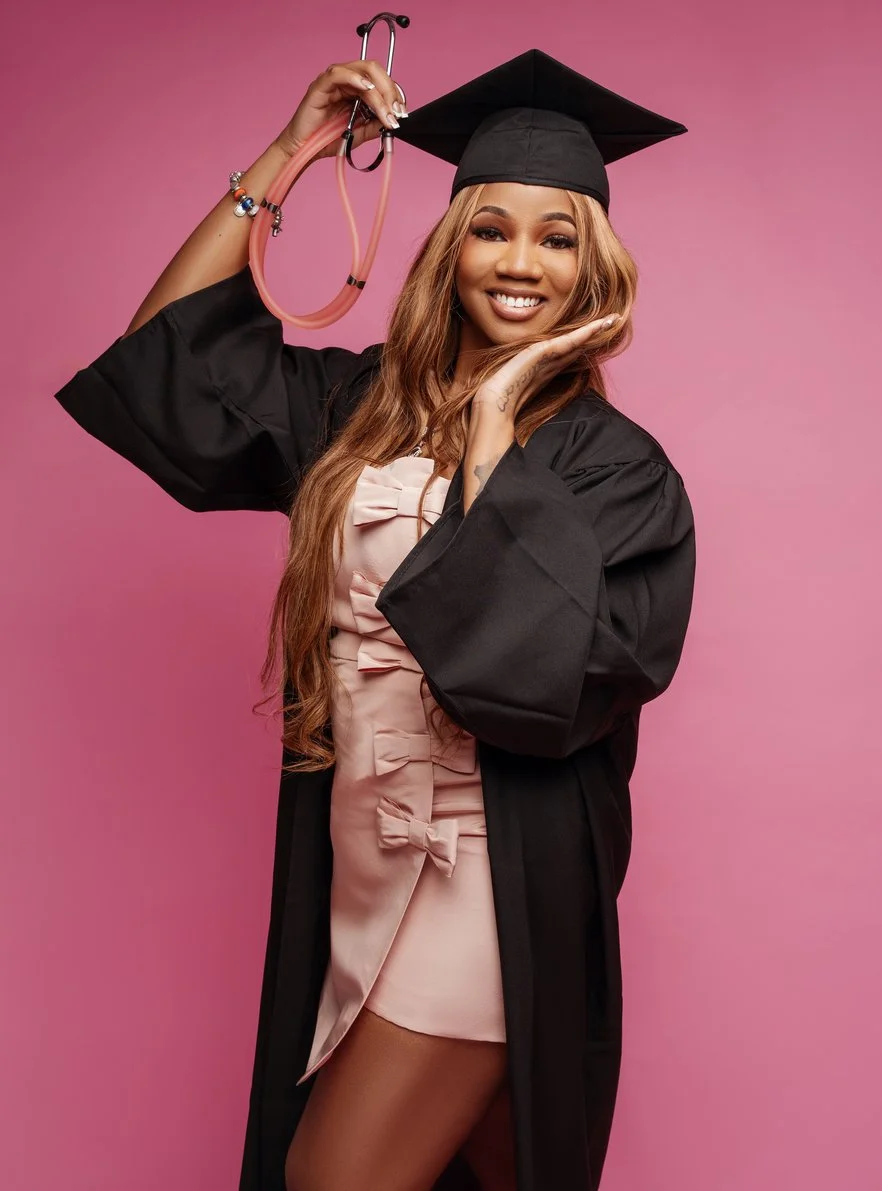 Graduation portrait session with graduate with pink stethoscope posing in Chicago - Filaneyka photo studio
