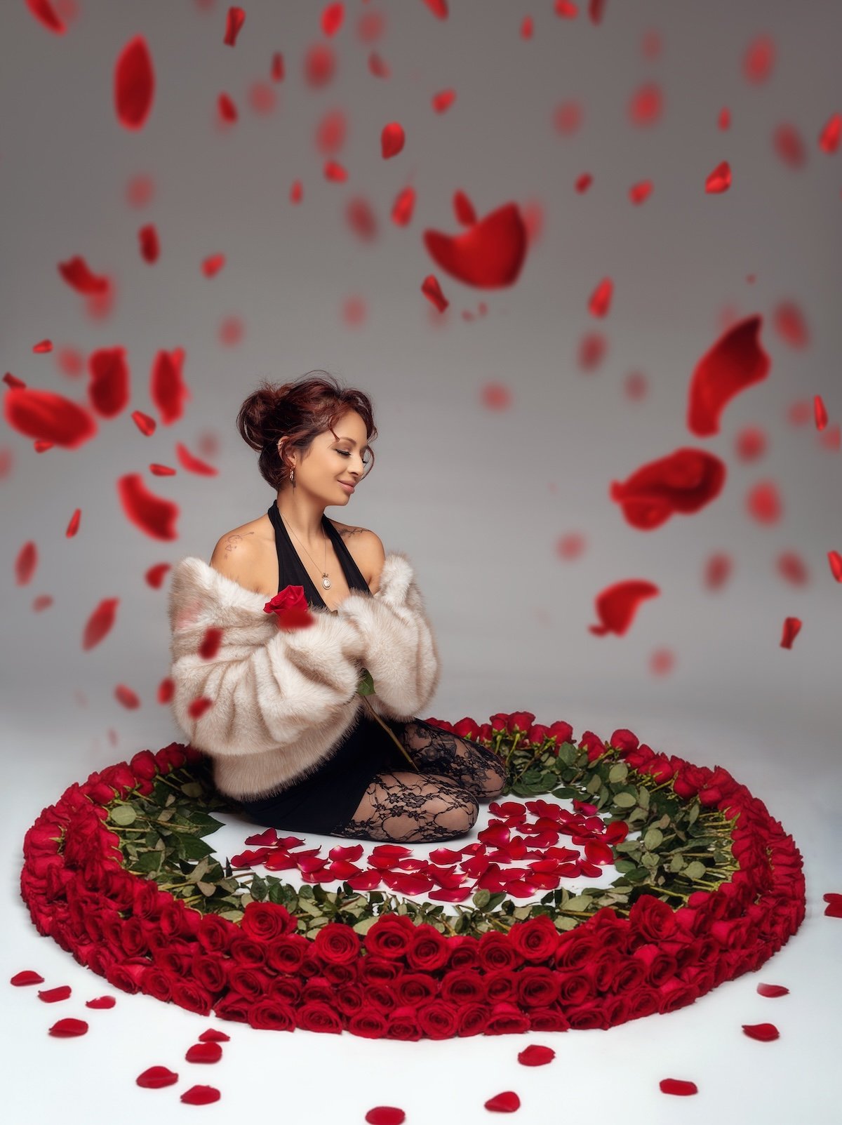 Individual session showcasing elegant black lingerie look with relaxed yet intense pose in a circle of roses, Chicago, Filaneyka photo studio