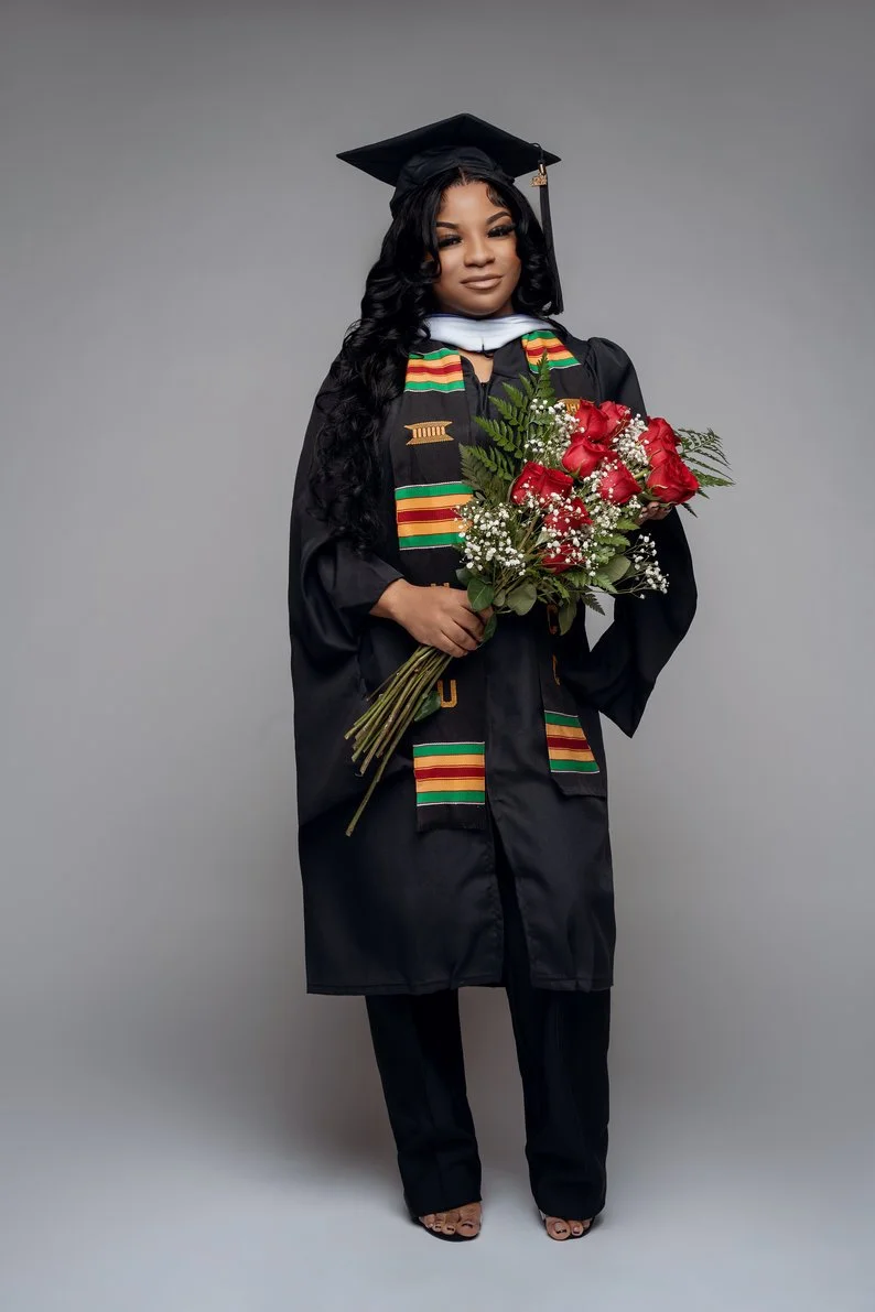 Graduation celebration photoshoot with graduate holding red flower bouquet in Chicago - Filaneyka photo studio