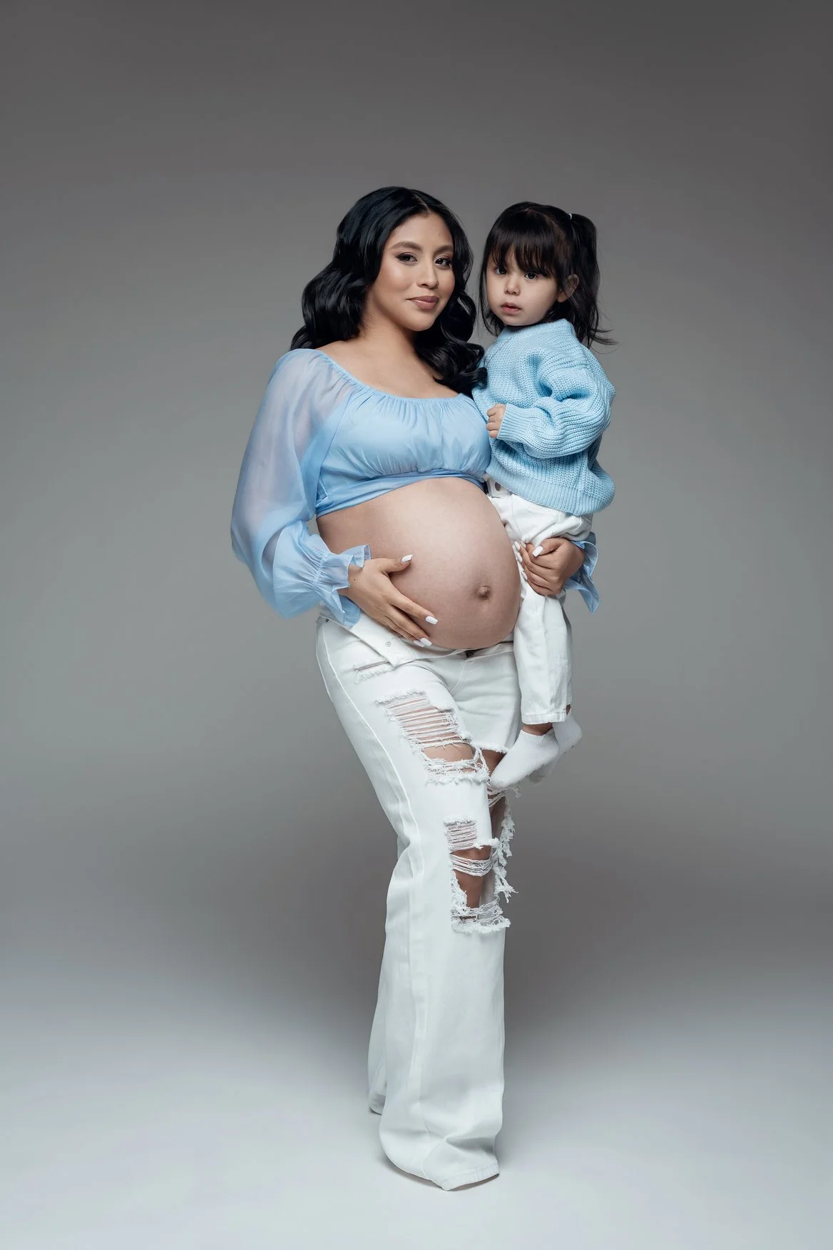 Maternity portrait session with pregnant mom holding toddler daughter in Chicago - Filaneyka photo studio