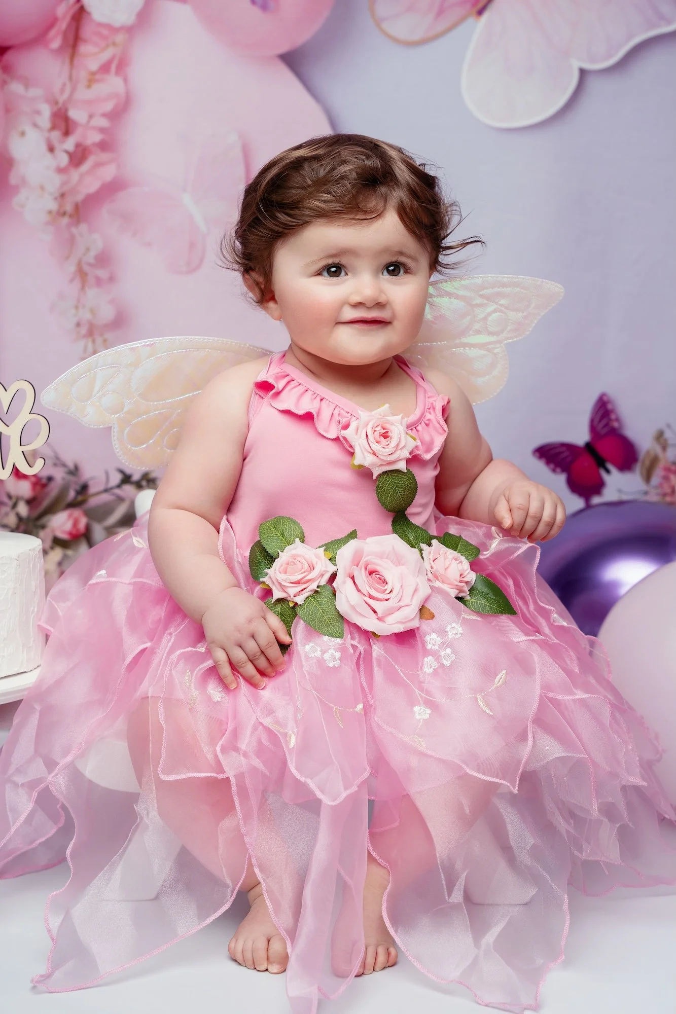  Pink tulle first birthday outfit with floral details from a Chicago photo studio collection for one-year-olds 