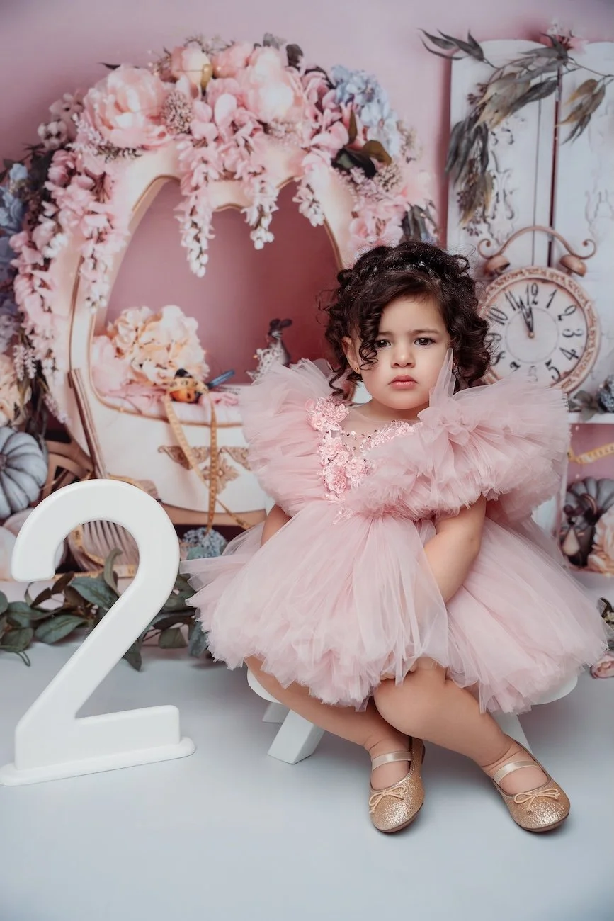 Family studio portrait with toddler in pink tutu birthday setup in Chicago - Filaneyka photo studio