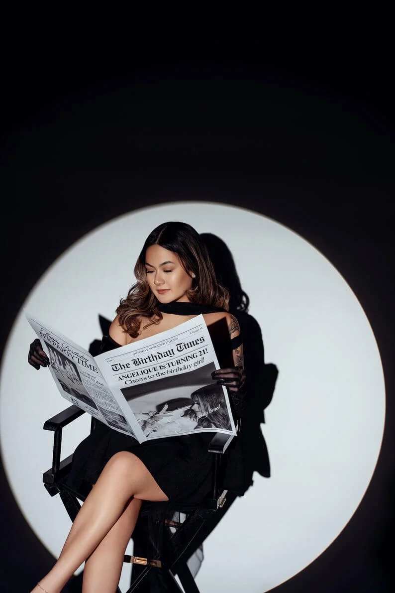 Birthday celebration photoshoot with spotlight reading birthday newspaper in Chicago - Filaneyka photo studio