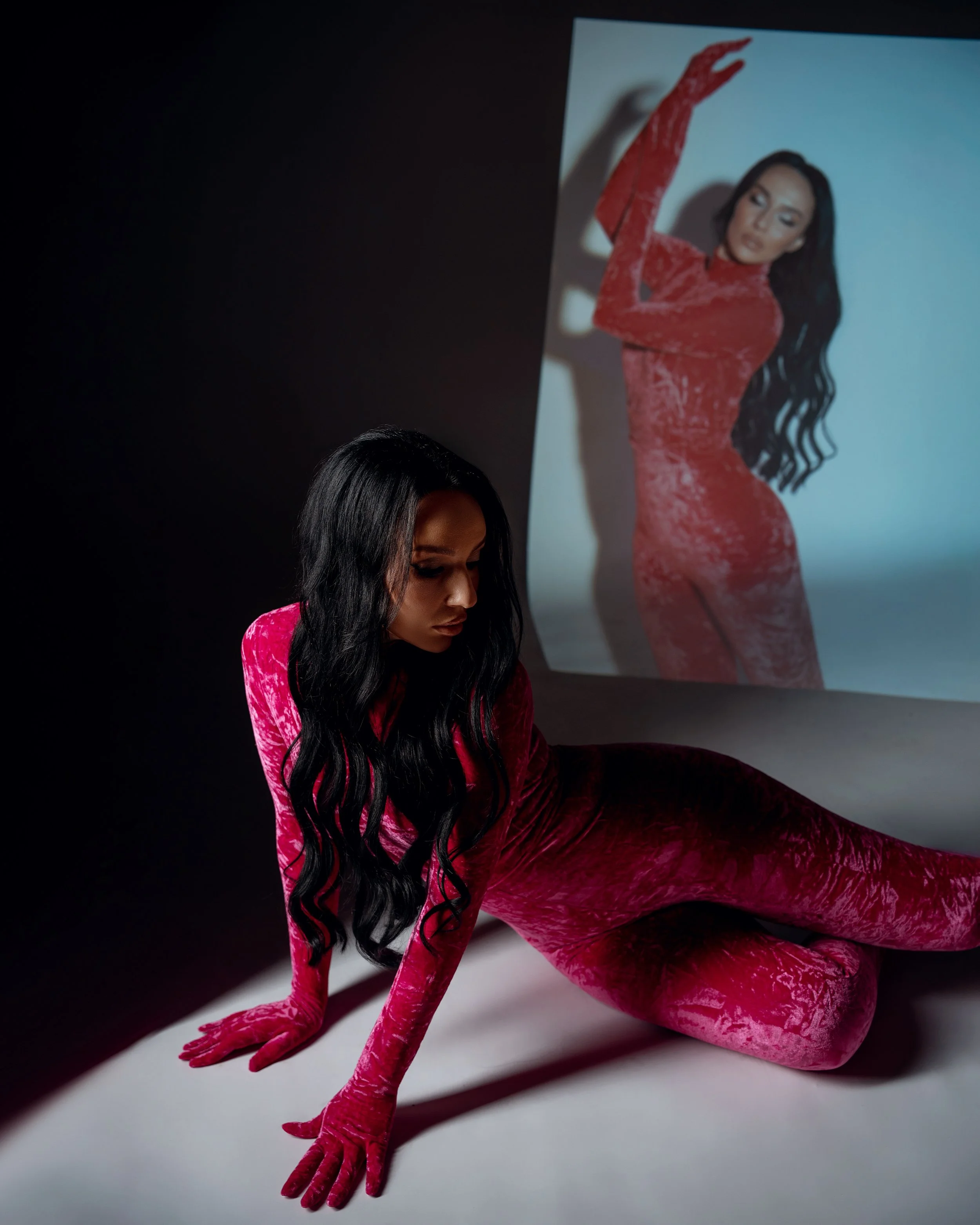 Professional headshot photography with pink catsuit with projected image in Chicago - Filaneyka photo studio