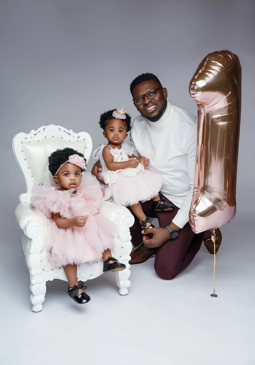 1st birthday photography with father and twin daughters in pink tutus in Chicago - Filaneyka photo studio