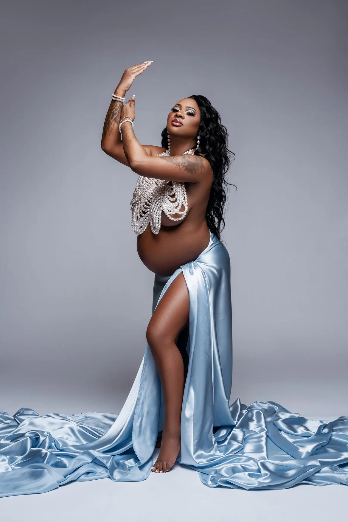 Pregnancy photography with blue satin glamorous pregnancy pose in Chicago - Filaneyka photo studio