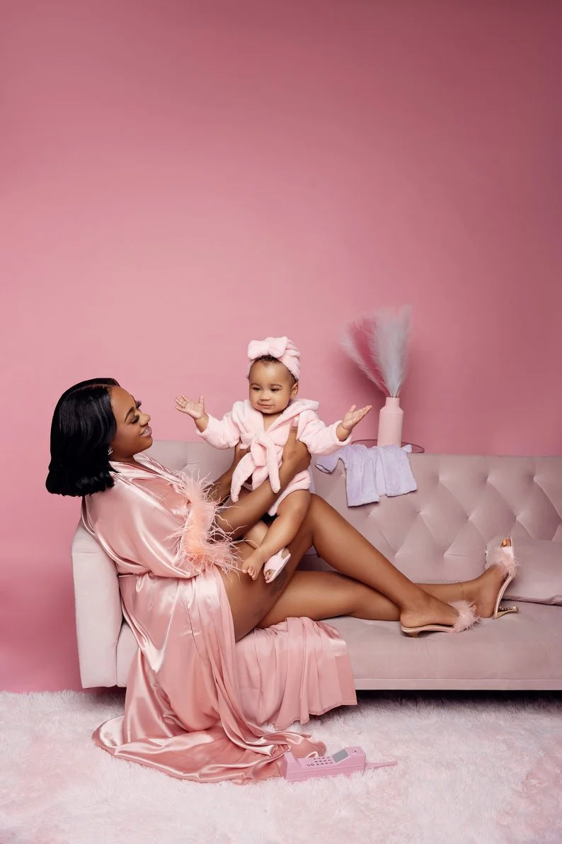 Cake smash session with mother and daughter on pink couch setup in Chicago - Filaneyka photo studio
