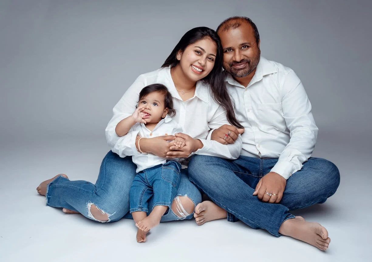 Family studio portrait with family of three in matching outfits in Chicago - Filaneyka photo studio